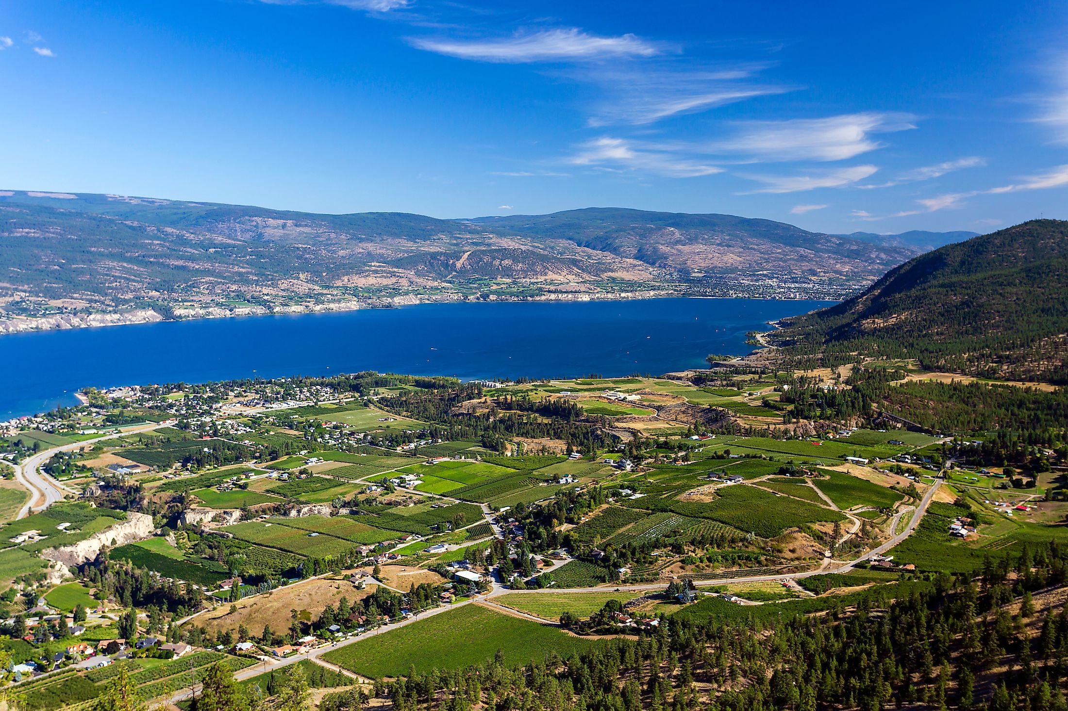 View of agricultural fields, vineyards, and Okanagan Lake from Giants Head Mountain in Summerland.
