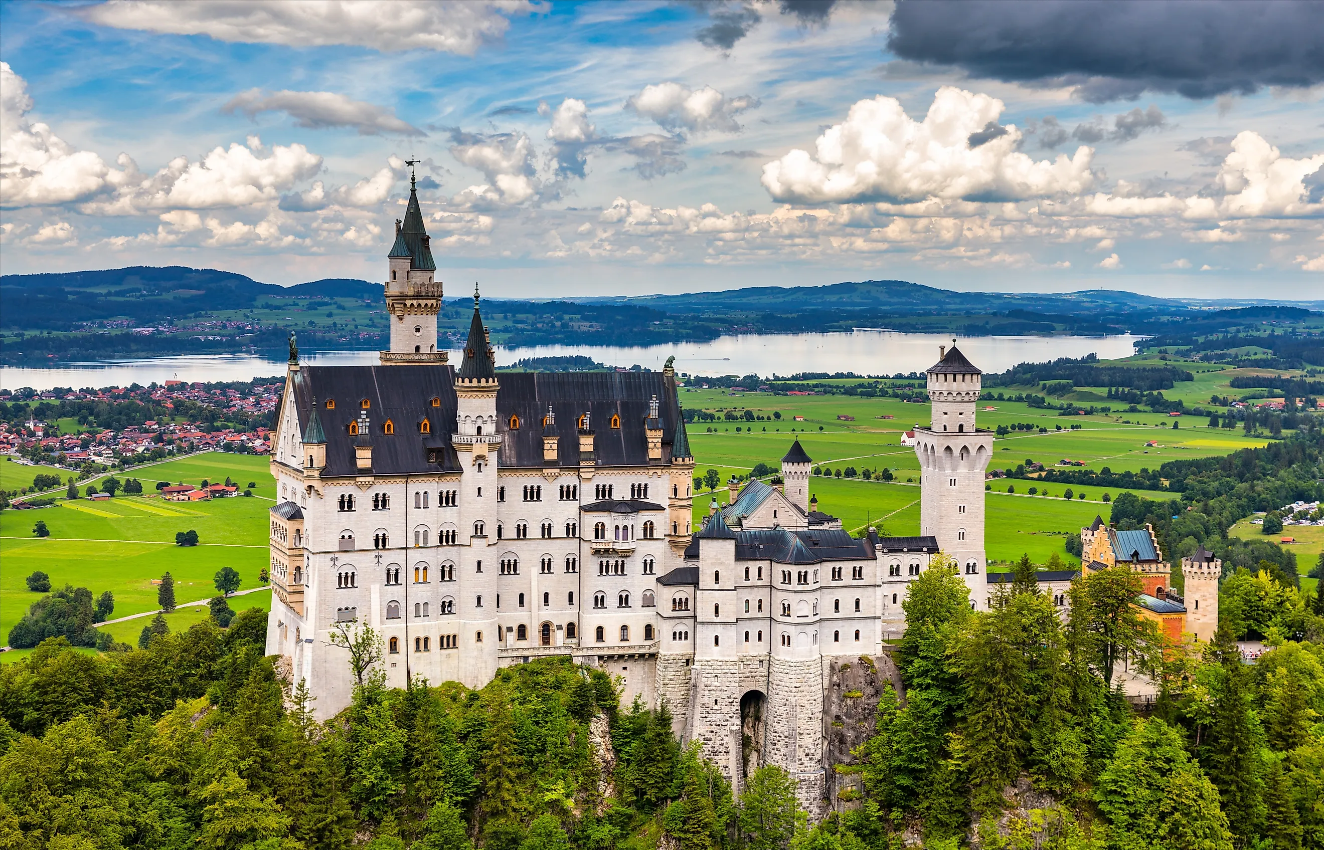 Neuschwanstein Castle near Füssen in Bavaria, Germany, overlooking the village of Hohenschwangau in the Bavarian Alps