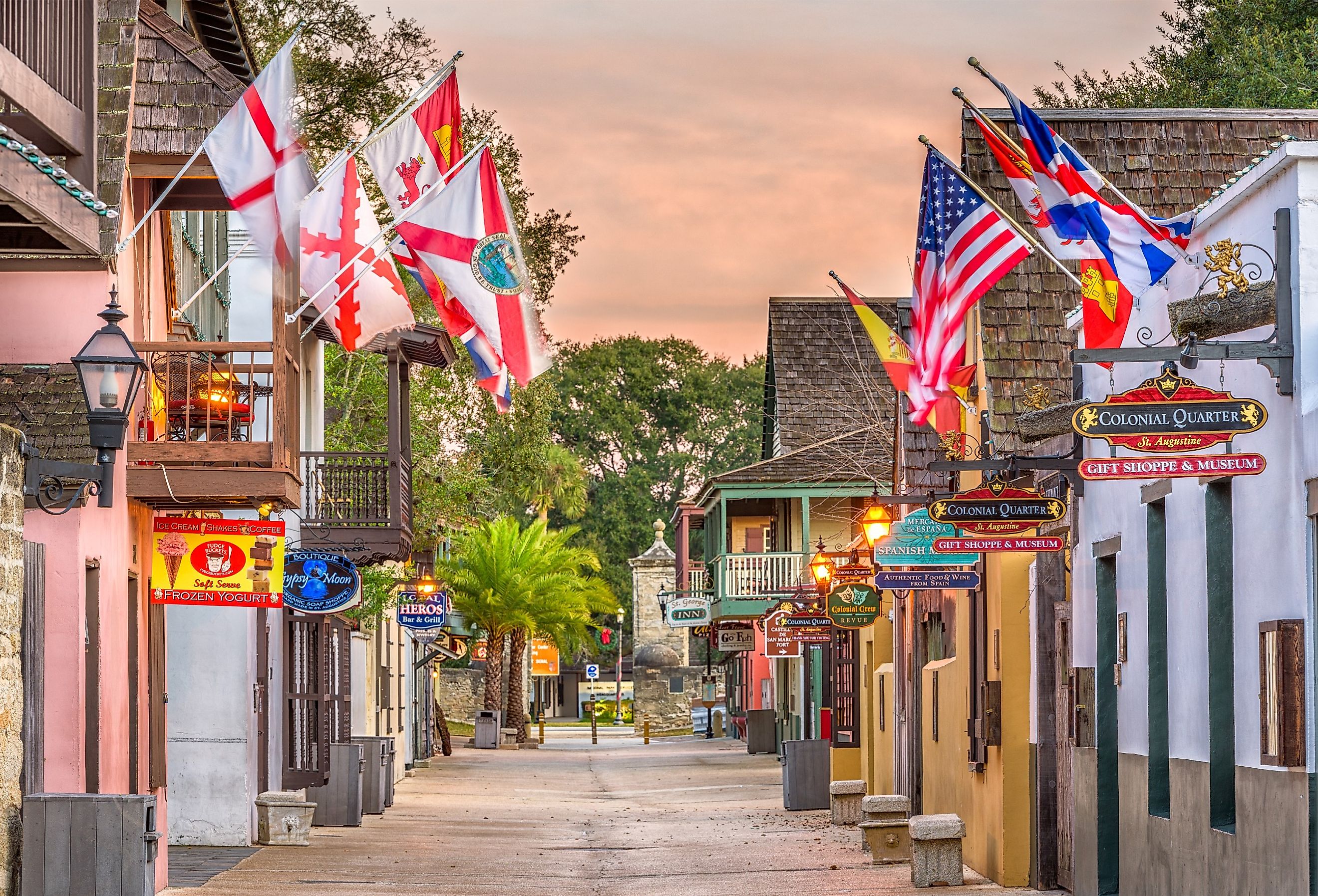 St. Augustine, Florida, shops and inns line St. George street with flags. Image credit Sean Pavone via Shutterstock