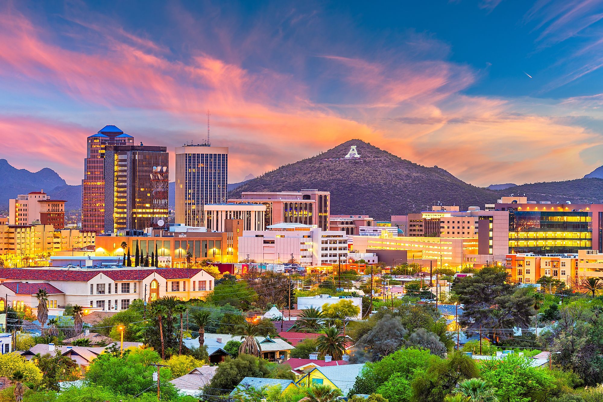 Tucson, Arizona, USA downtown skyline with Sentinel Peak at dusk.