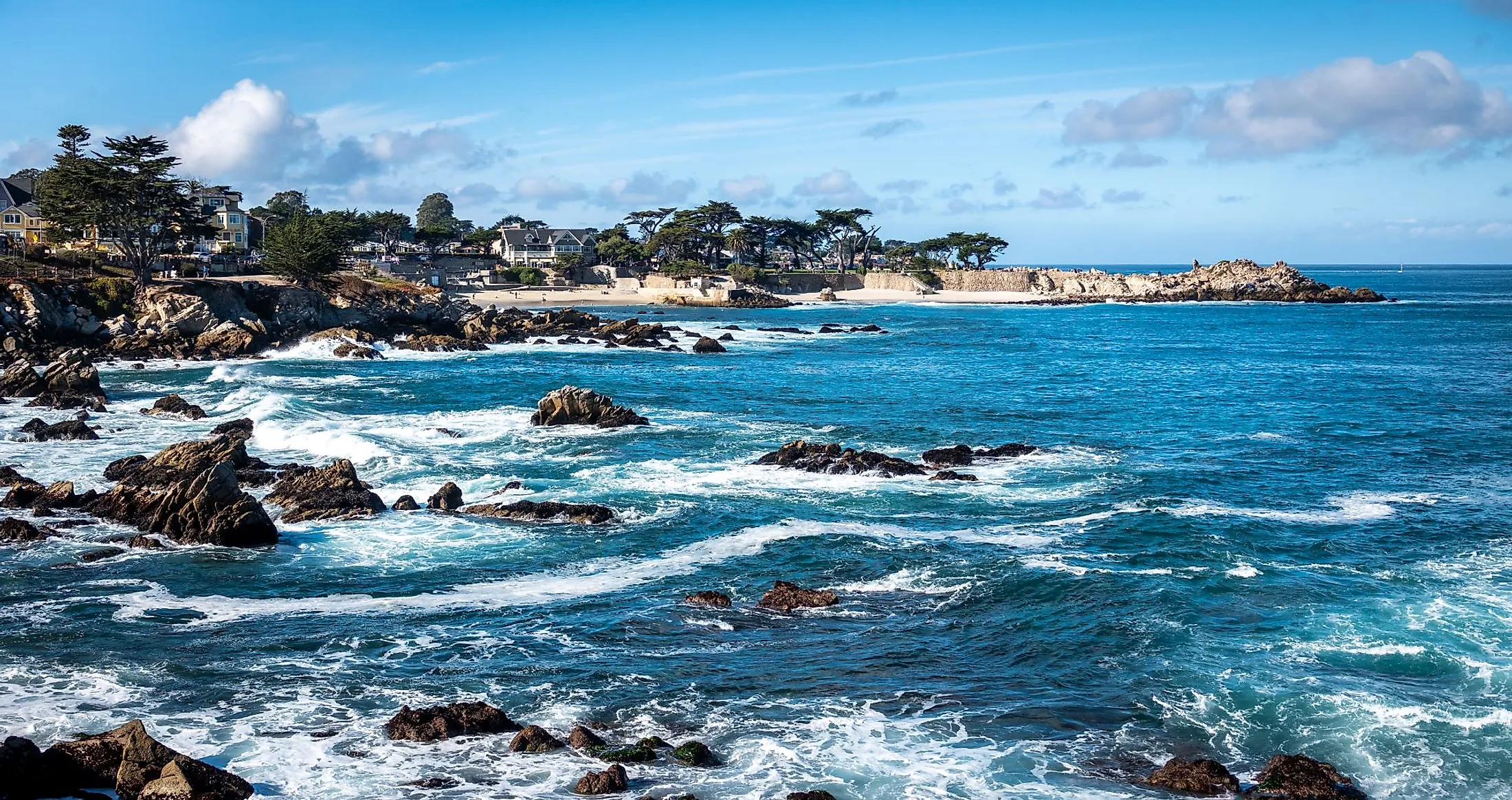 Waves splash on the rocky coast along the Monterey Bay in Pacific Grove, Ca...