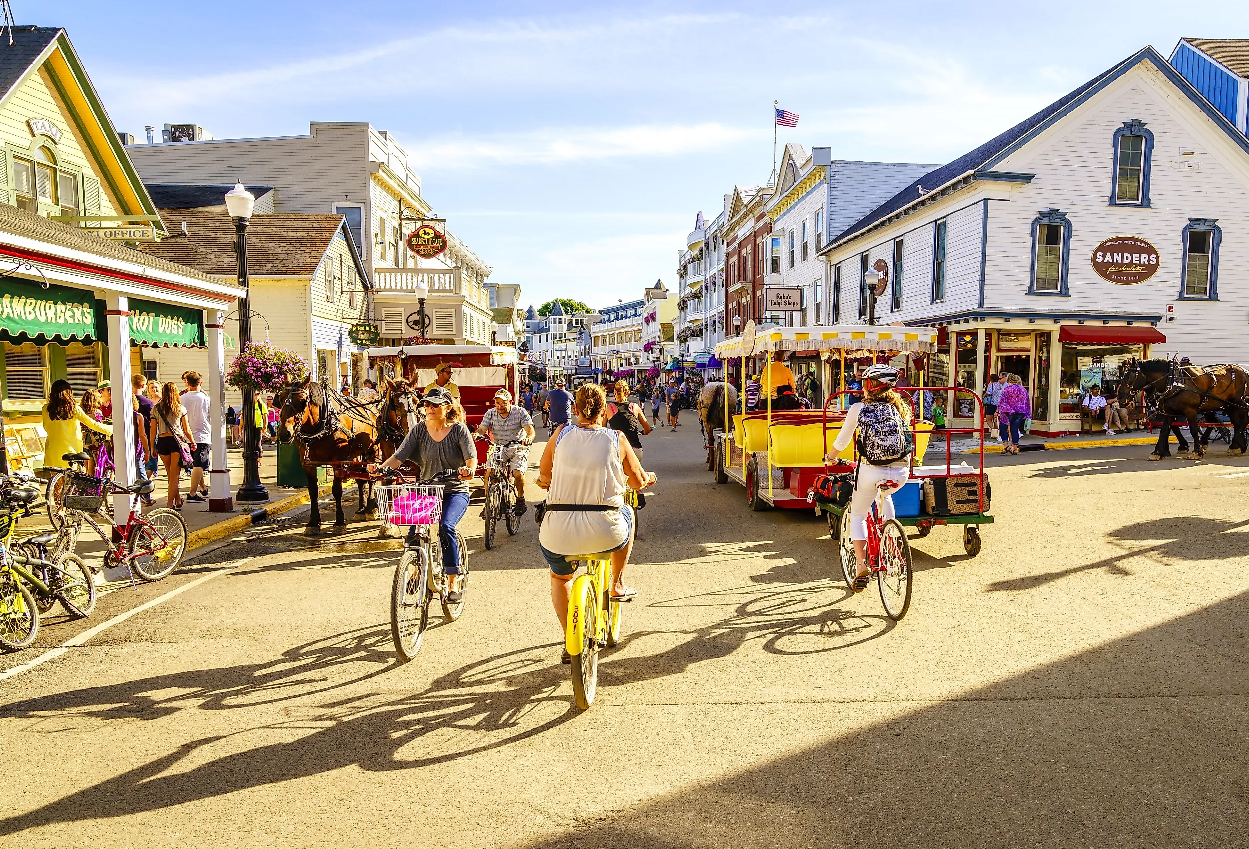 Vacationers take on Market Street in Mackinac Island, Michigan. Image credit Alexey Stiop via Shutterstock.