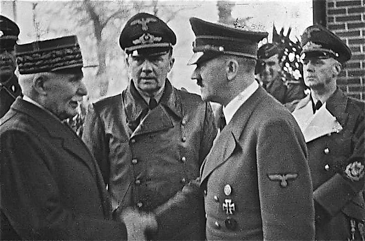 Nazi German leader Adolf Hitler meeting with his French "client" state's leader, Philippe Pétain, after France fell to the Nazis in 1940.