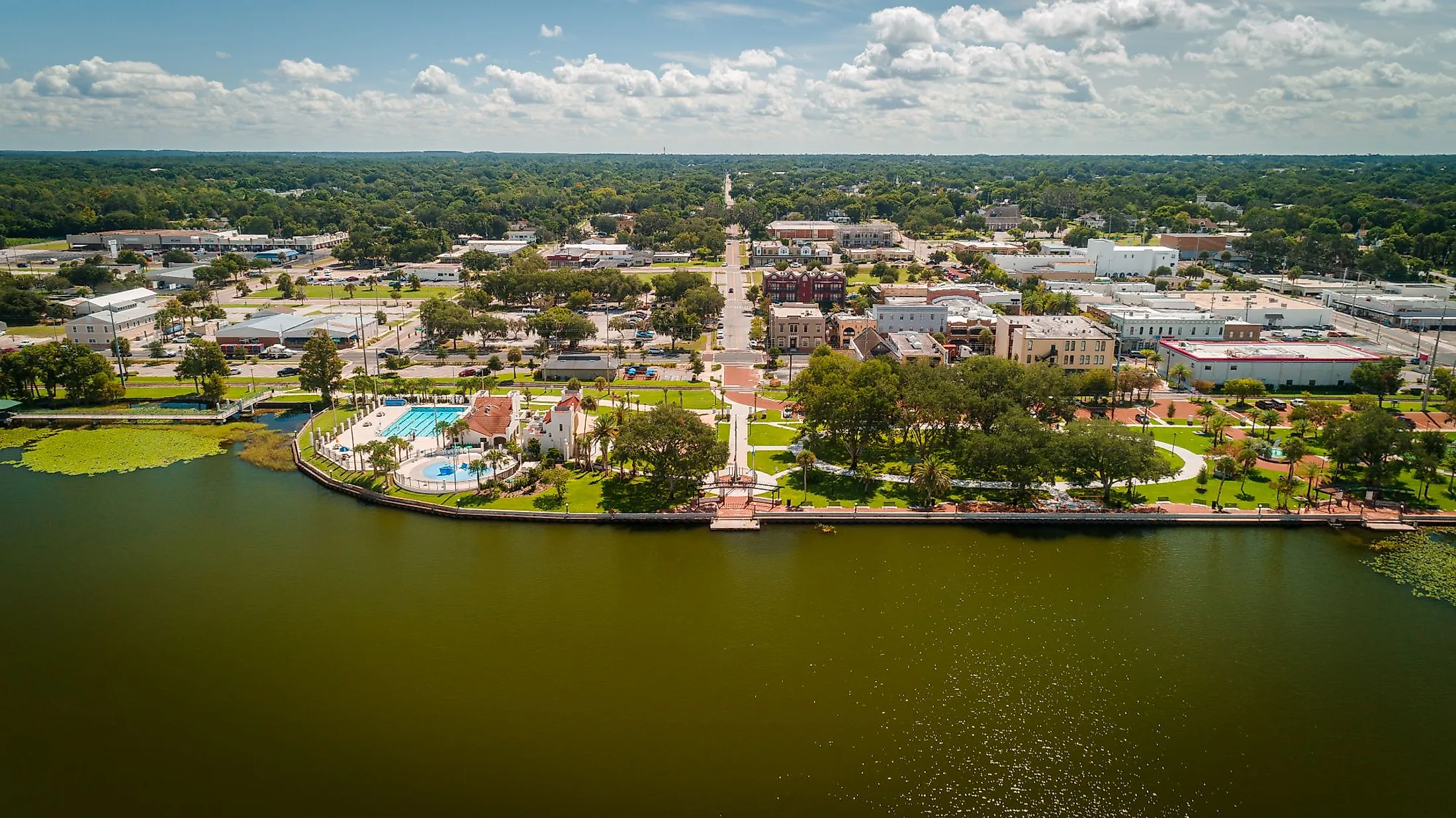 Drone view over Lake Eustis facing Ferran Park in downtown Eustis, Florida. Editorial credit: Noah Densmore / Shutterstock.com