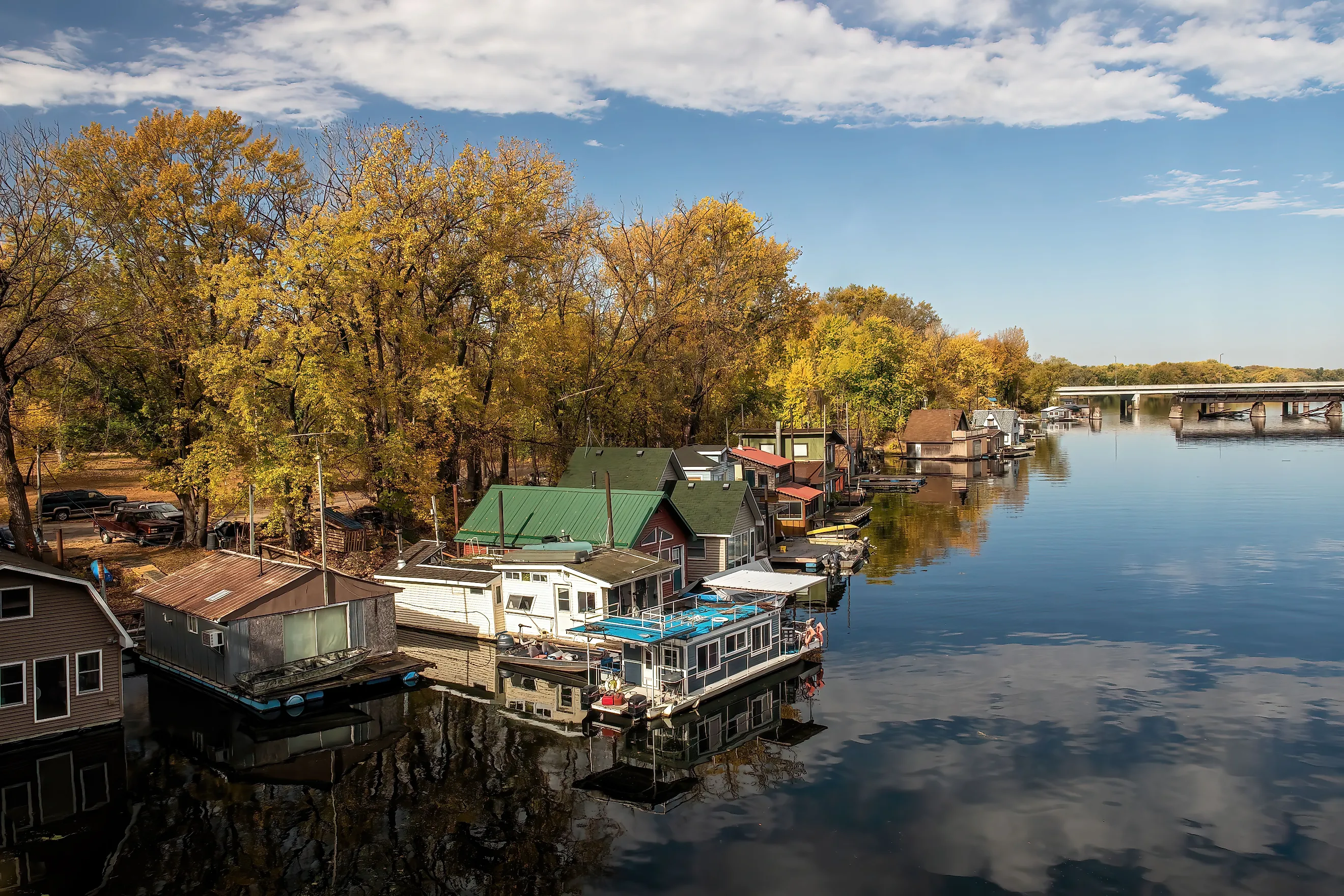 Winona, Minnesota USA October 12, 2022 Houseboats on Latsch Island in the backwaters of the Mississippi River on an autumn morning, taken from the Latsch Island Bridge in Winona, Minnesota USA.