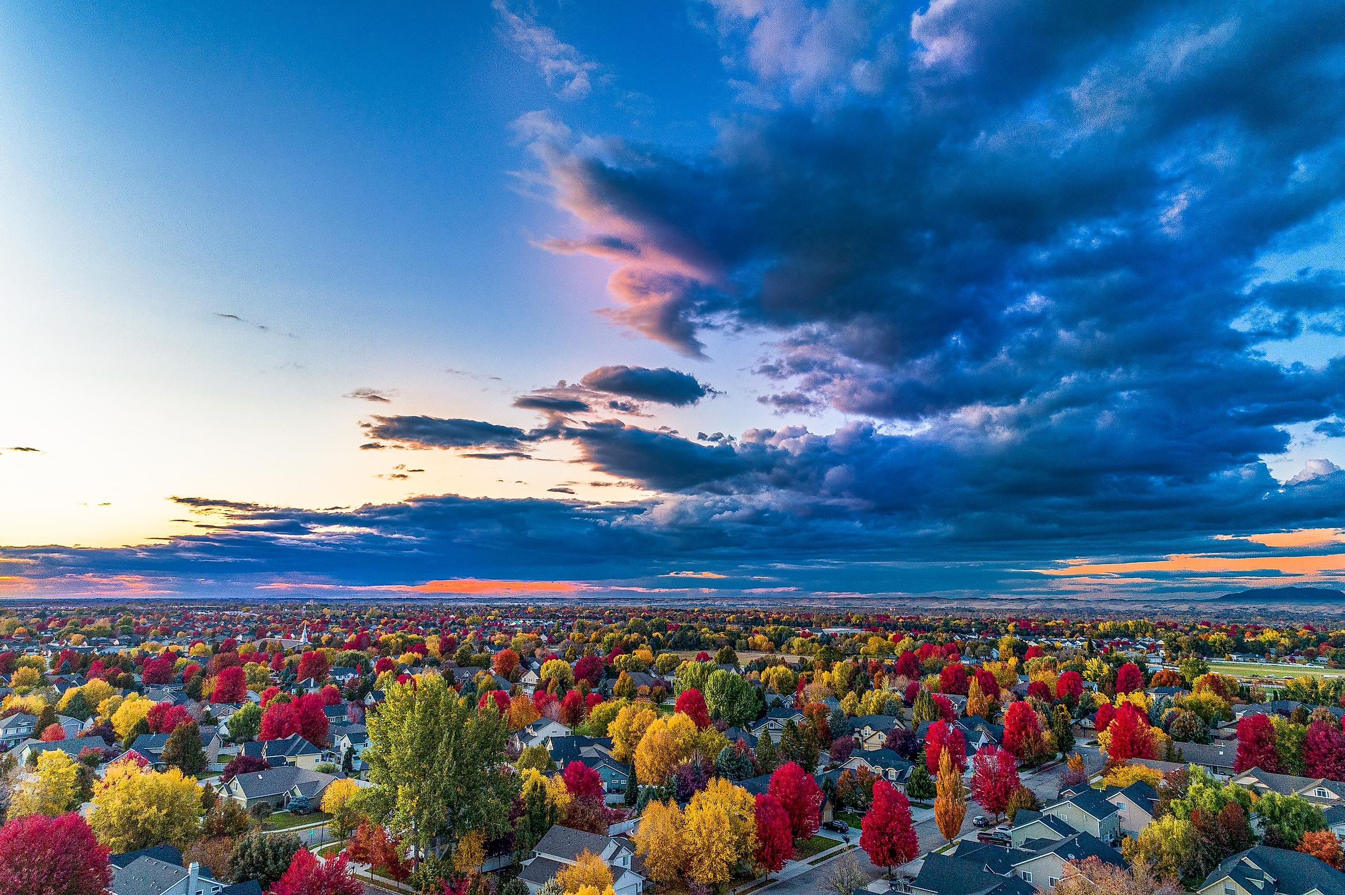  Fall colors over Boise during sunset, with streets and small houses visible.