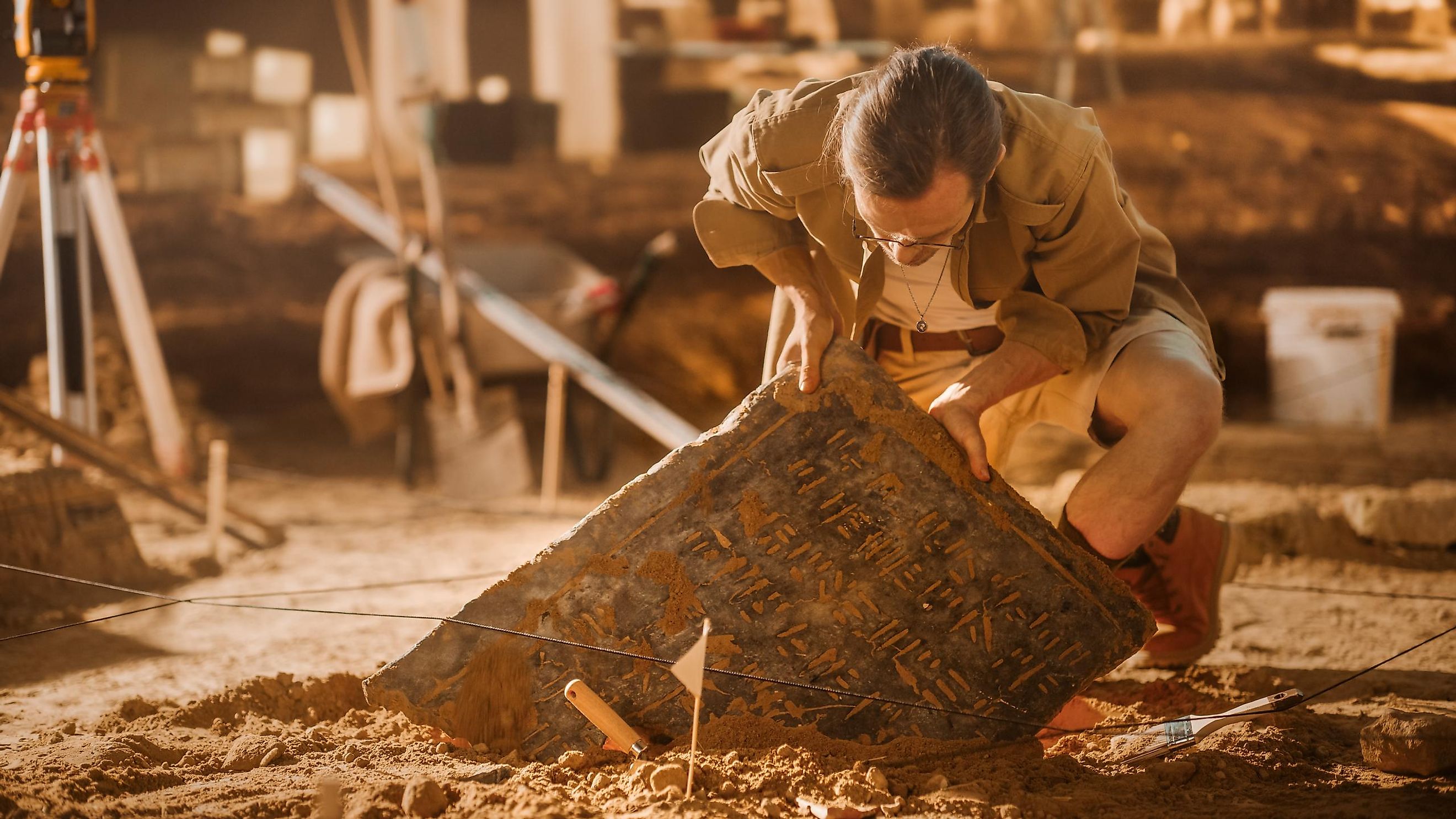 An archeologist digging out an artifact.