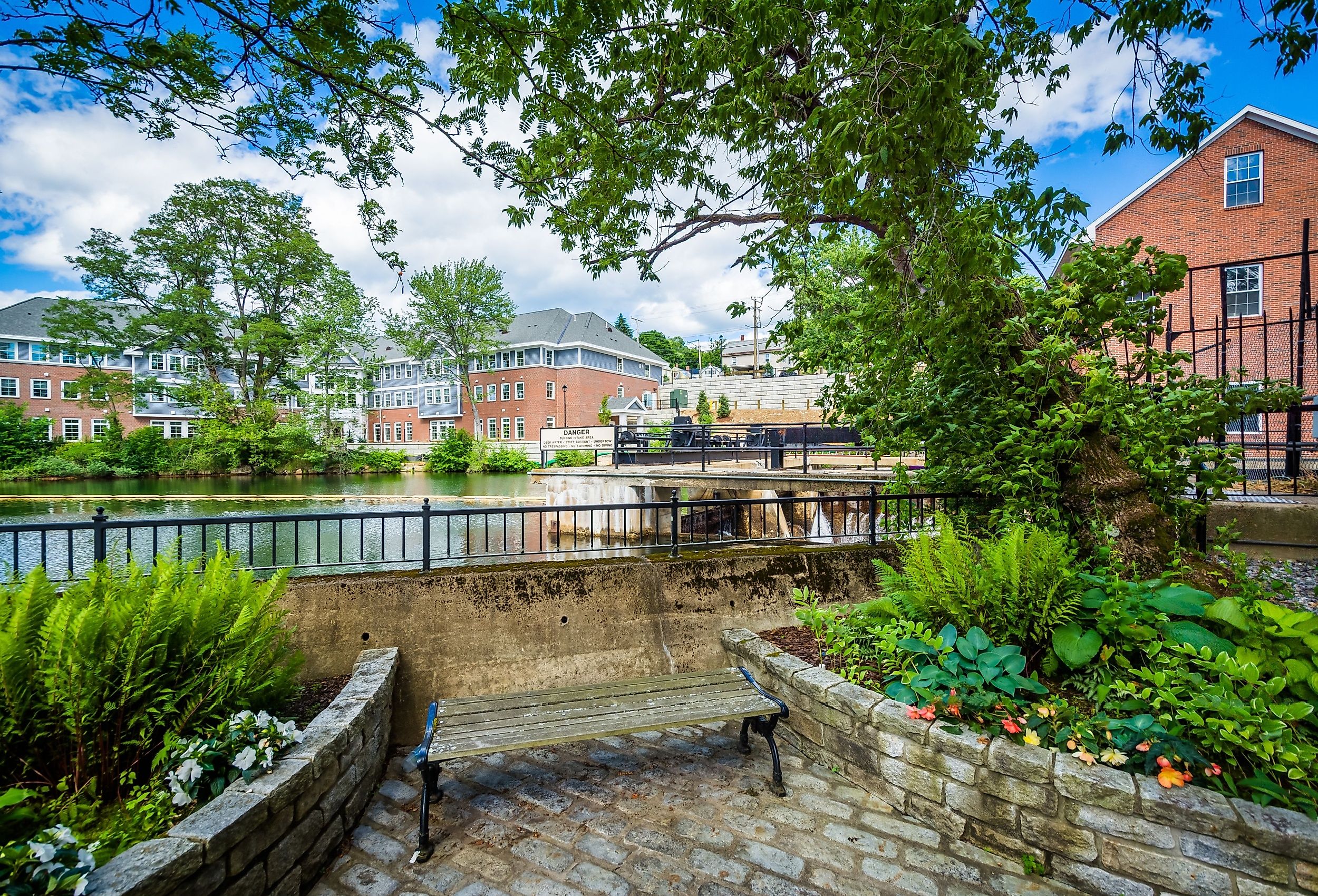 Gardens and bench along the Winnipesaukee River, in Laconia, New Hampshire.