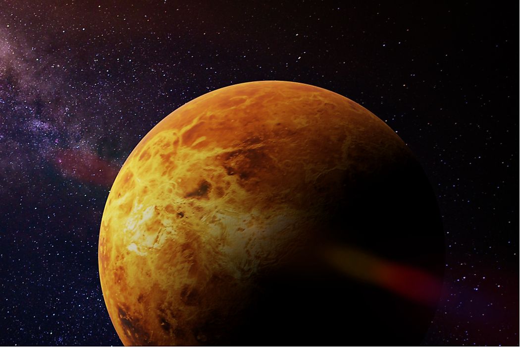 A dense carbon dioxide cloud gives Venus a reddish-brown appearance.