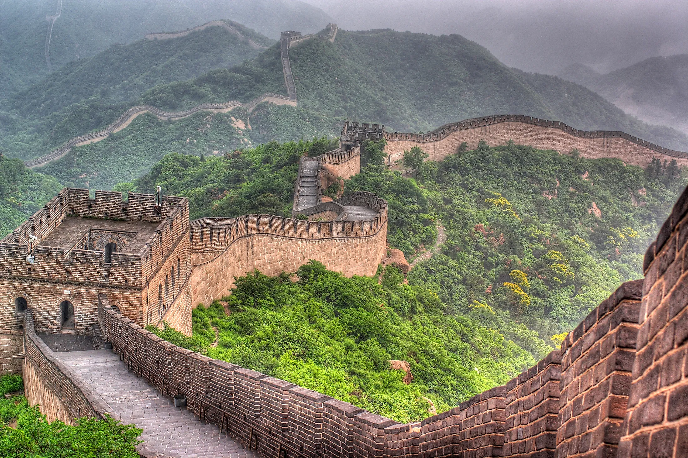 Crumbling Great Chinese Wall running down a hill, Huanghua Great Wall of  China, Great Wall