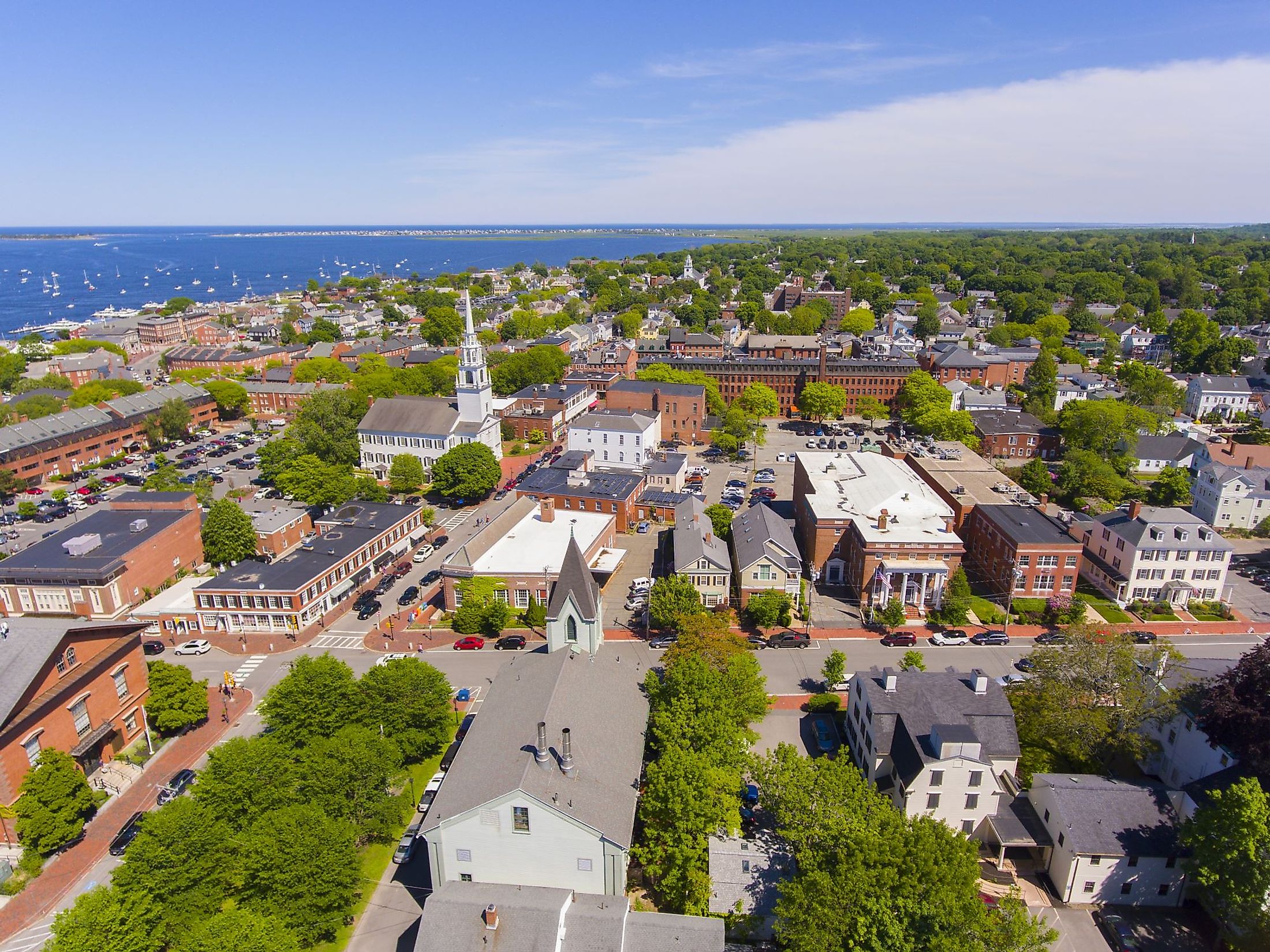 Aerial view of Newburyport historic downtown including State Street and First Religious Society Unitarian Universalist Church with Merrimack River at the background. 