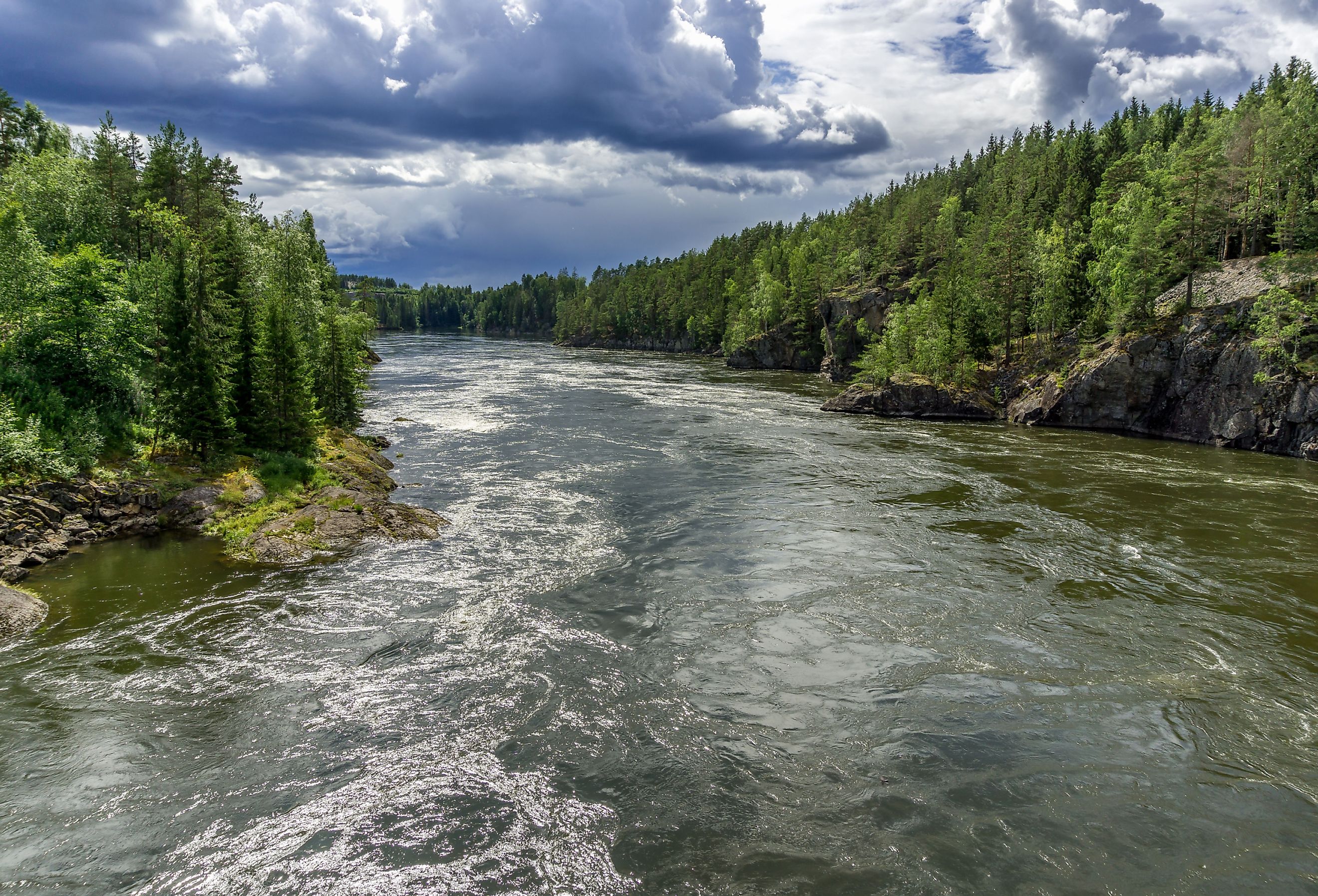 Beautiful and Mighty Glomma River in Norway. Scenic view of the biggest Norwegian river during summer day. Image credit designium via Shutterstock. 