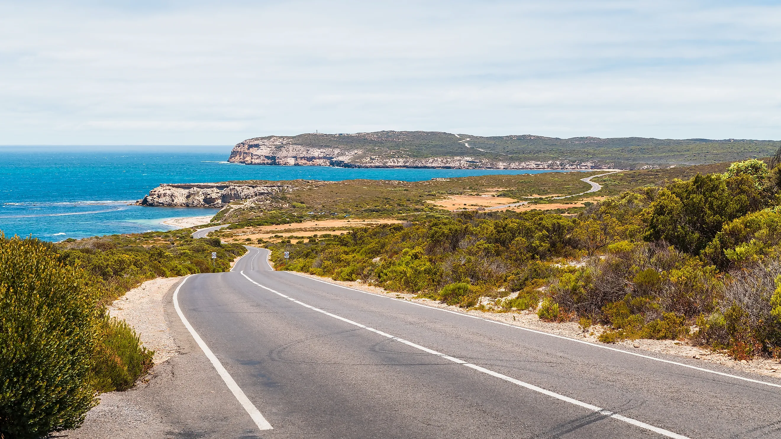 Winding road along the coast of Innes National Park on a bright day, Yorke Peninsula, South Australia.