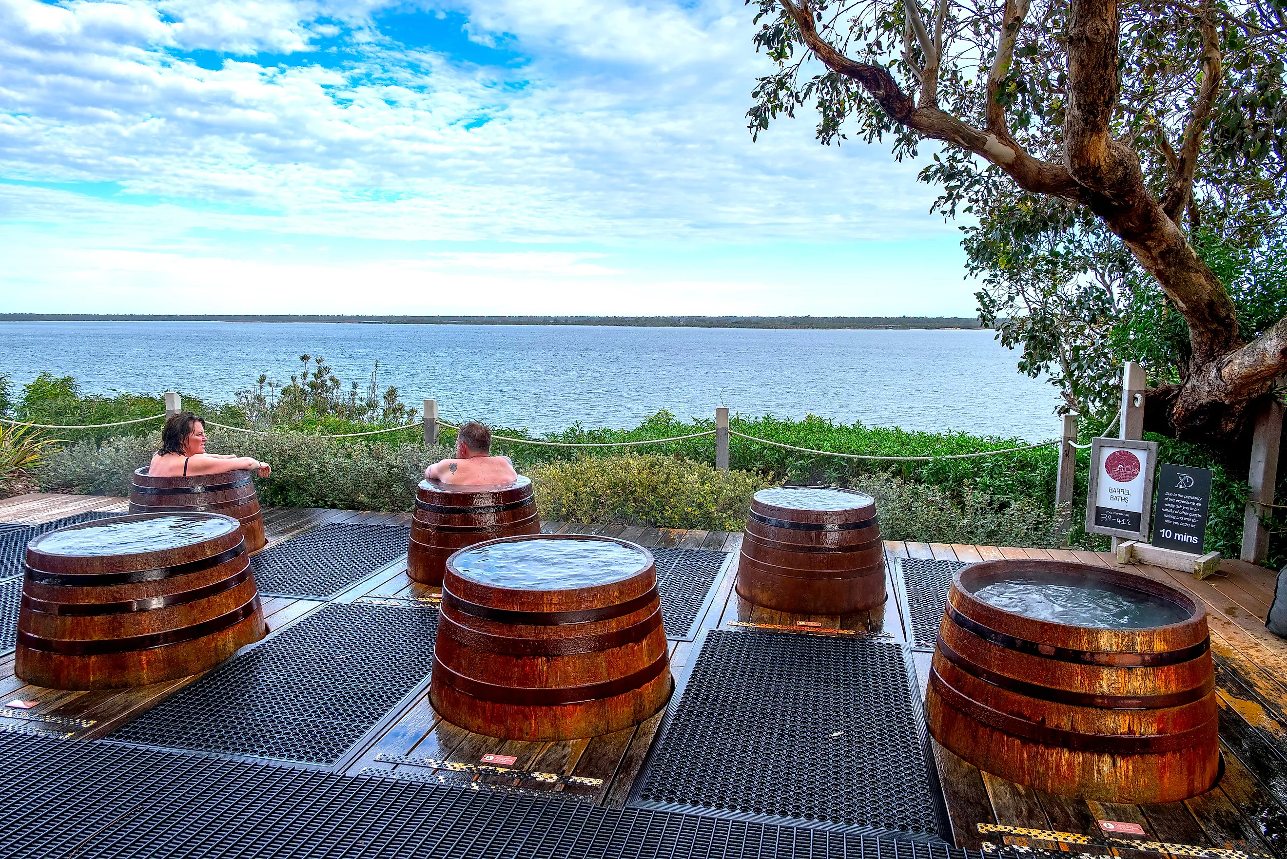 Individual barrel spas at Metung Hot Springs, a natural spa resort in the Gippsland Lakes of Metung, Victoria. Image credit: Paul Harding 00 / Shutterstock.com.