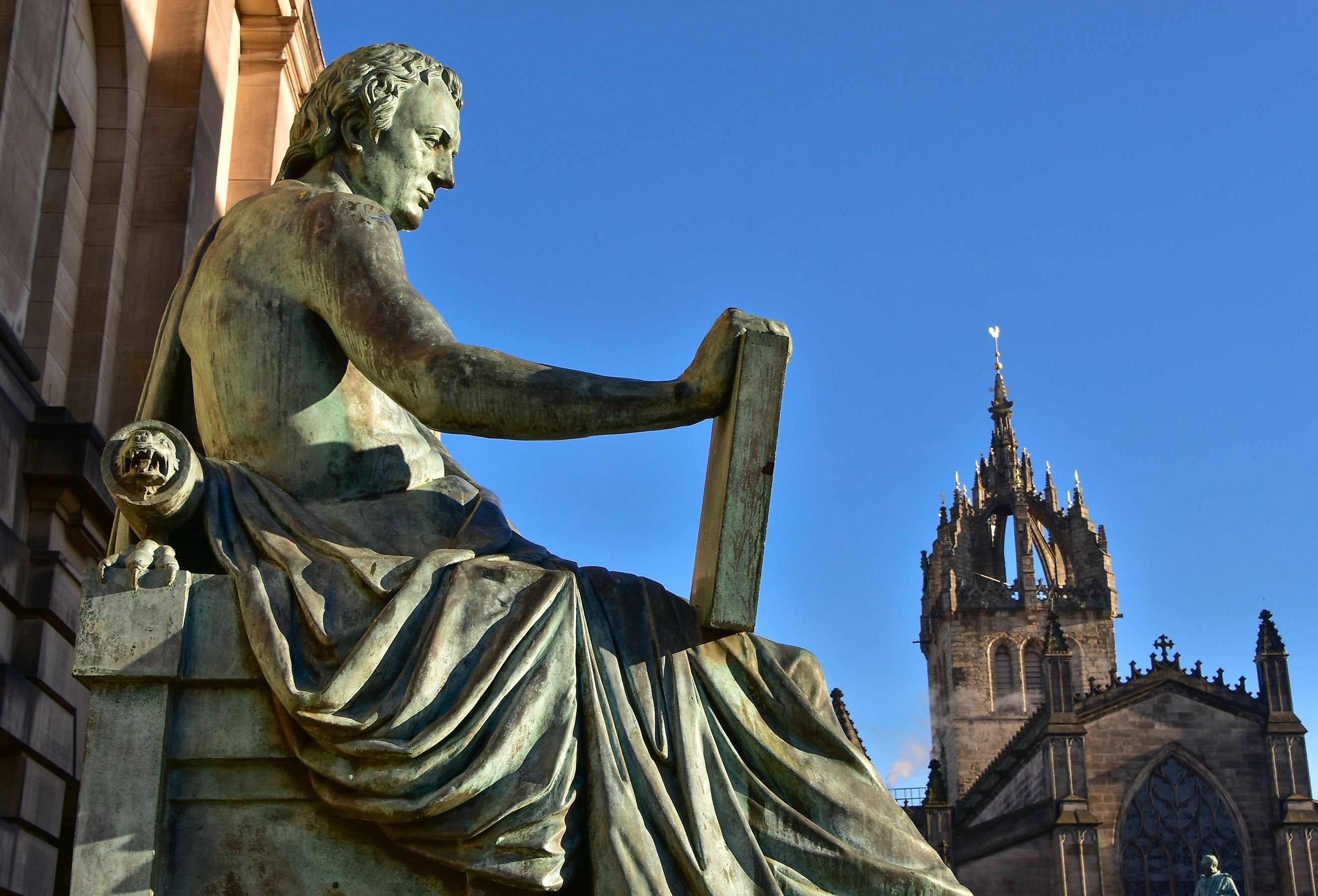 Statue of David Hume with St Giles' Cathedral in the background, Royal Mile, Edinburgh.