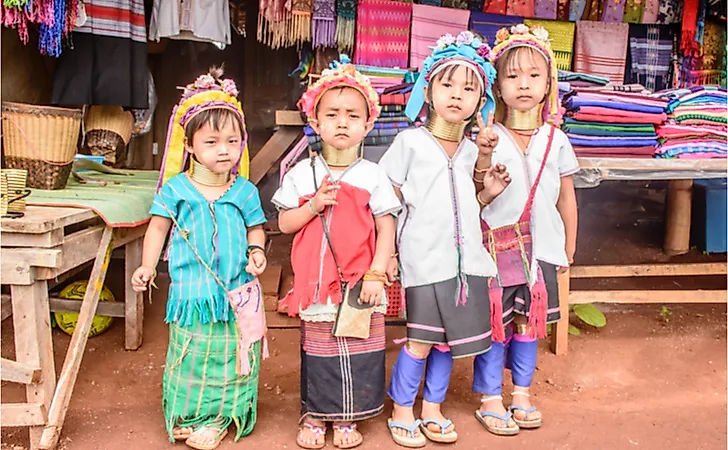 Younger Kayan women wear the neck coils primarily to cater to the tourist industry. Editorial credit: Aung Myat / Shutterstock.com