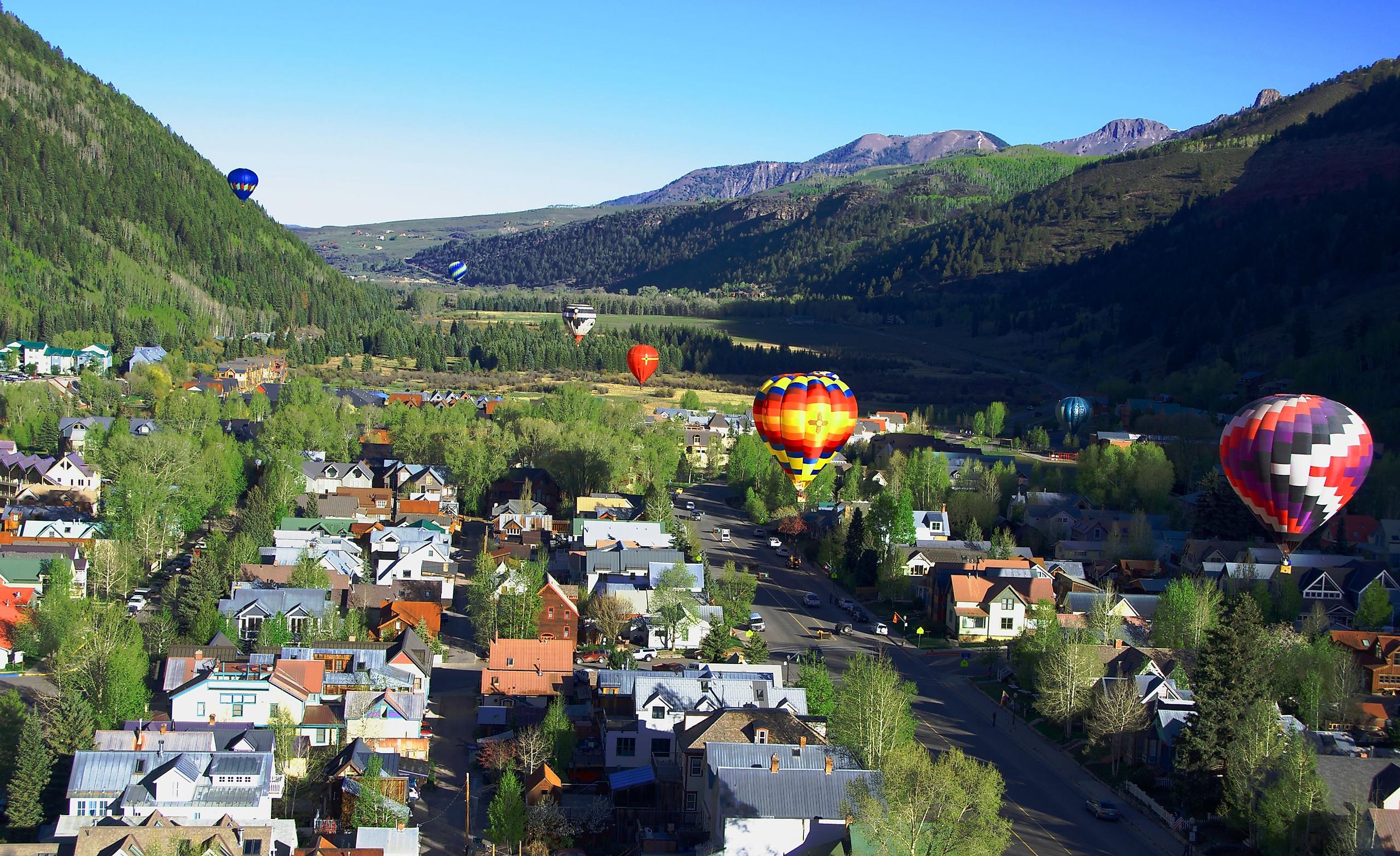 Balloon festival in Telluride Hot Air balloons flying over Town in the morning,Telluride, Colorado