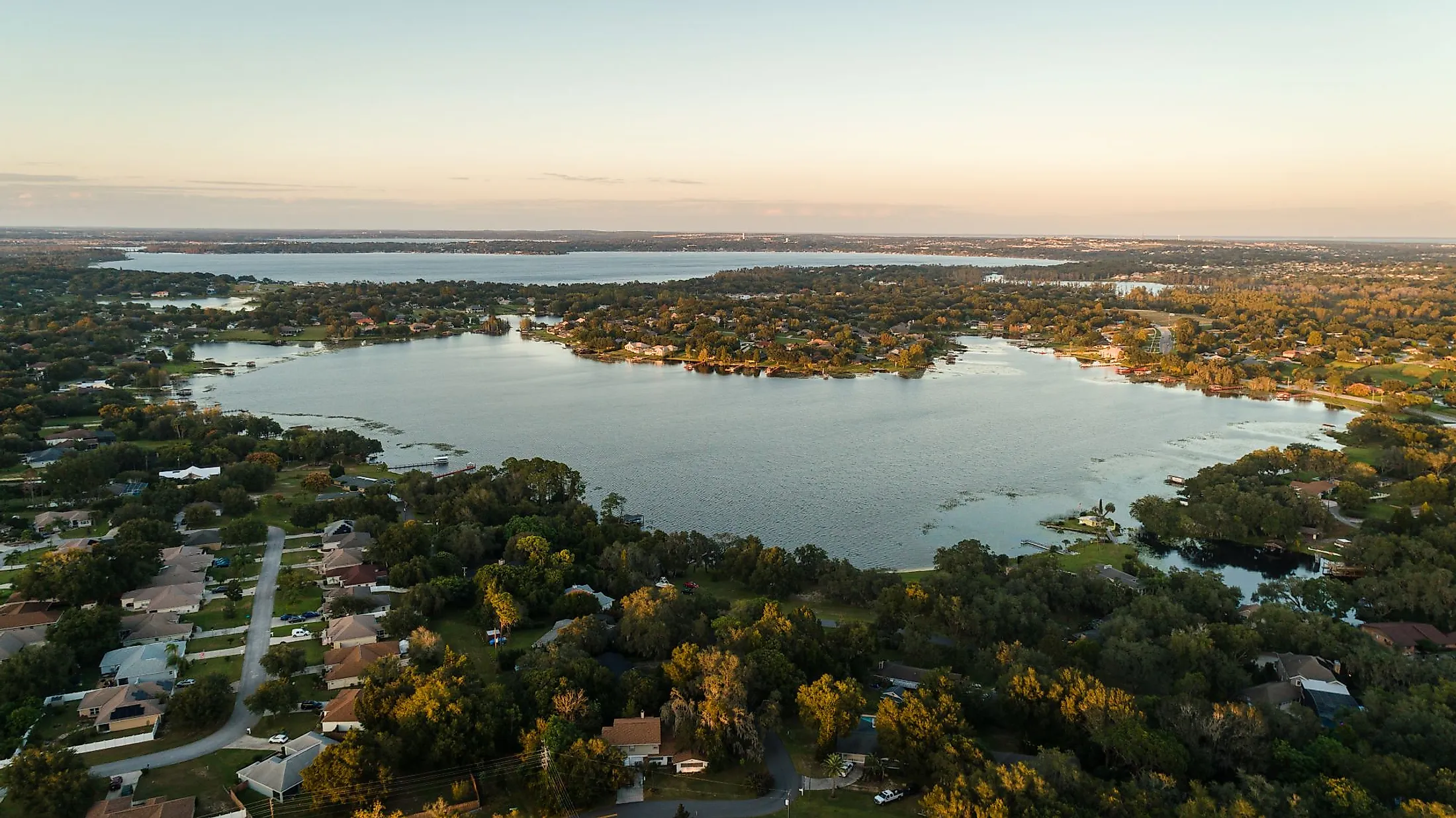 Drone view of the beautiful Crescent Lake of the Clermont Chain of Lakes. Editorial credit: Noah Densmore / Shutterstock.com