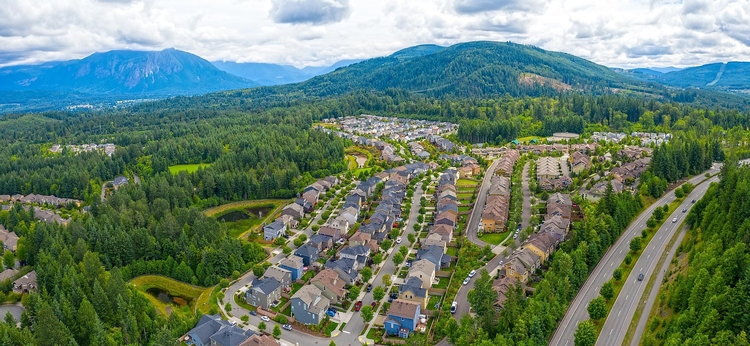 Snoqualmie Ridge, Washington, USA - Aerial overview of suburban neighborhood and forest community housing development.