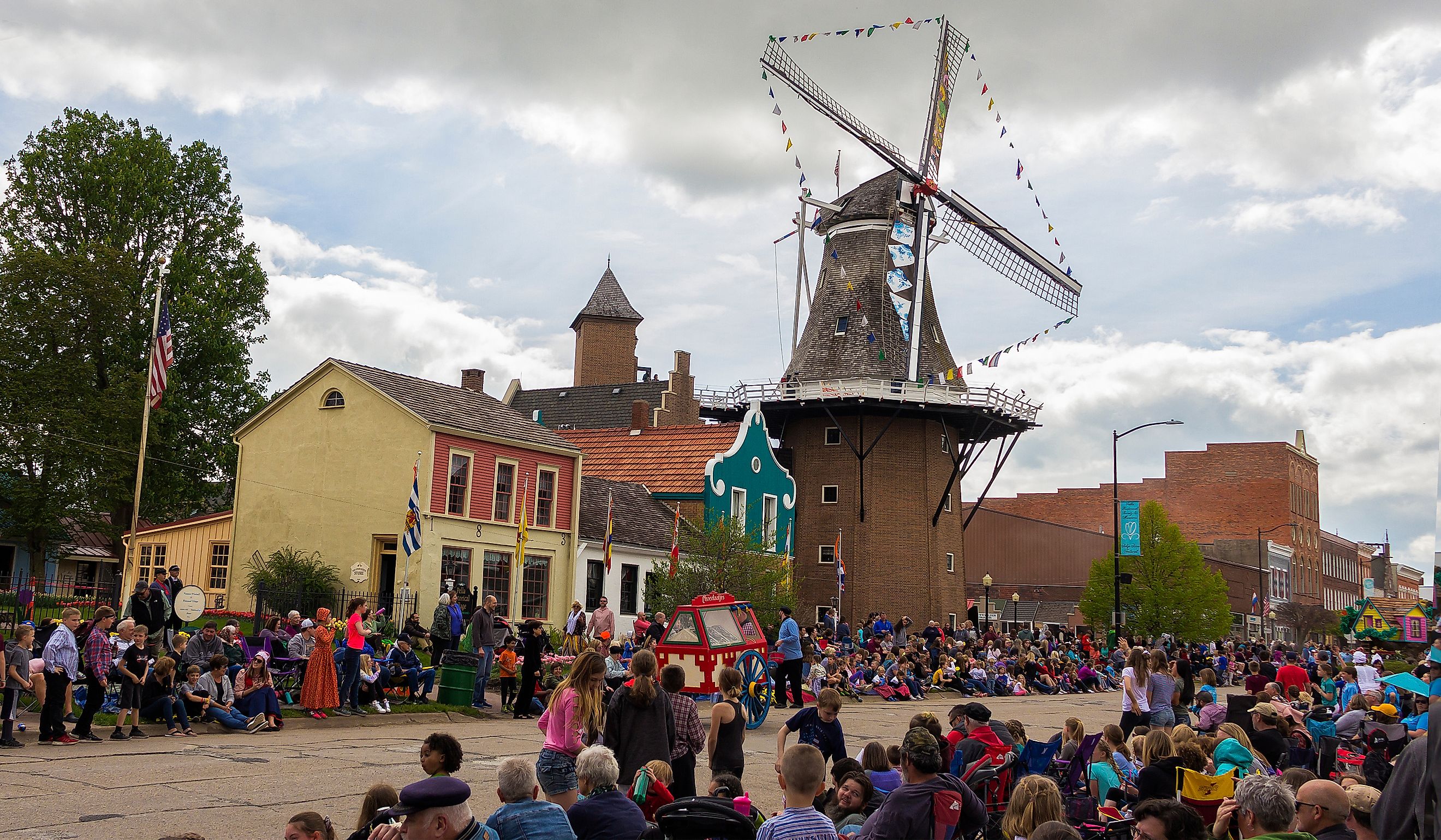 People celebrating the Tulip Time Festival in Pella, Iowa. Image credit yosmoes815 via Shutterstock