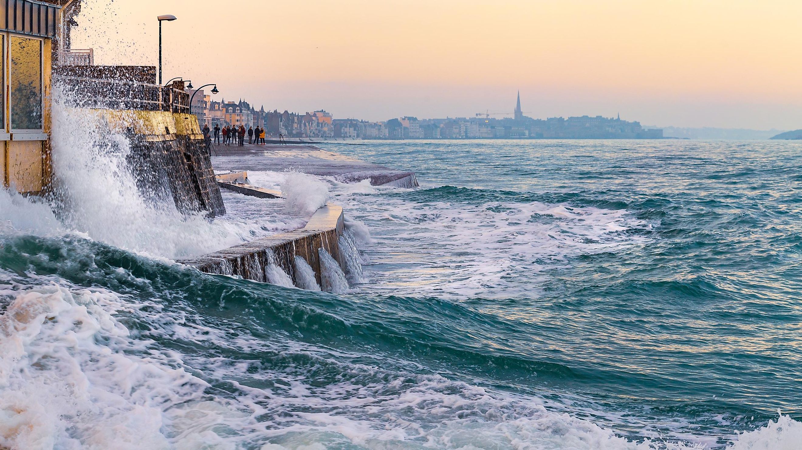 Waves lashing on the shore at high tide.