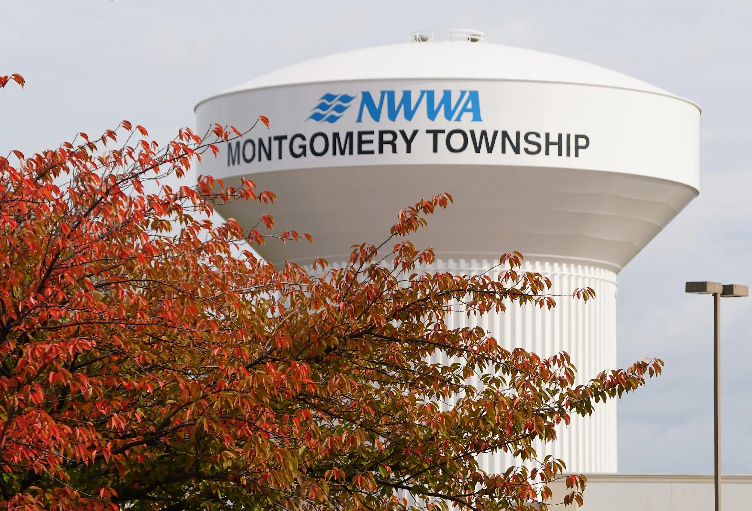 The water tower of NWWA Montgomery Township with the fall foliage, Pennsylvania. Image credit Khairil Azhar Junos via Shutterstock