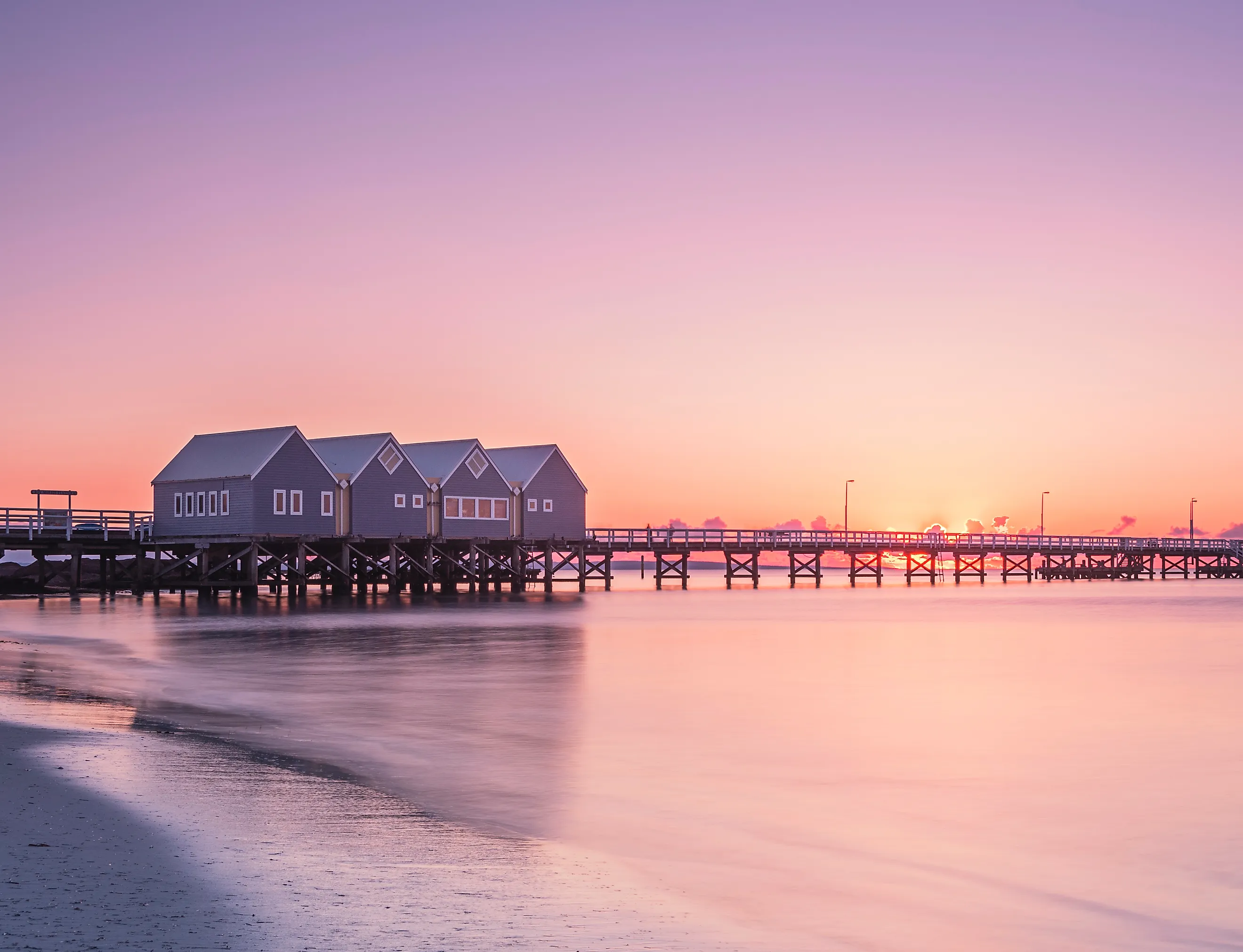 Busselton Jetty stretching into the ocean at sunset in Western Australia