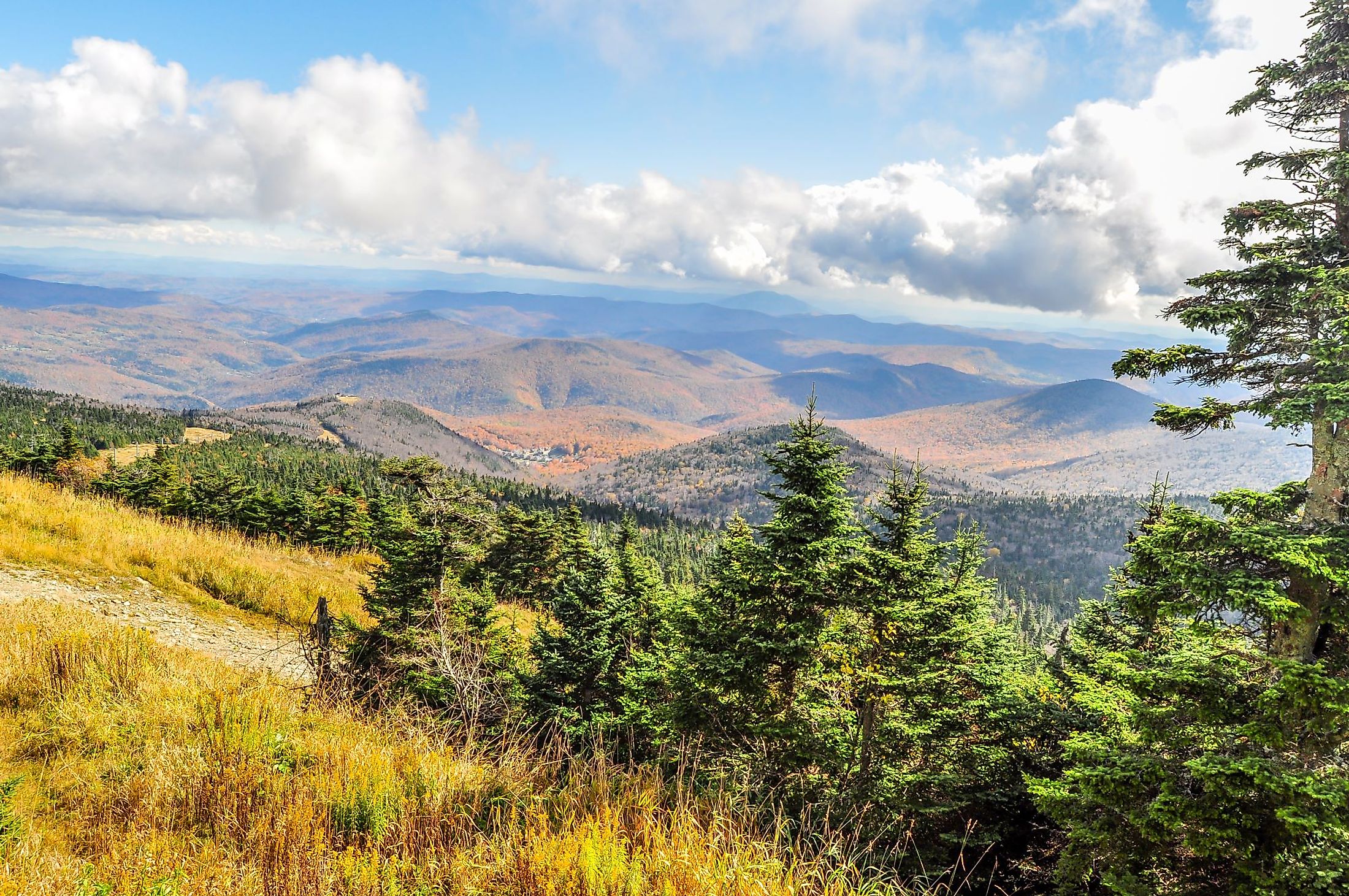 Clouds stream close over a landscape of autumn colors near Rutland, Vermont. 