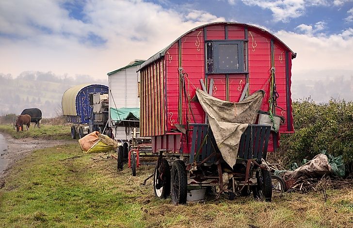 Traditionally nomadic, the Romani have long been associated with the large horse-drawn wagons they have often traveled in from place to place.