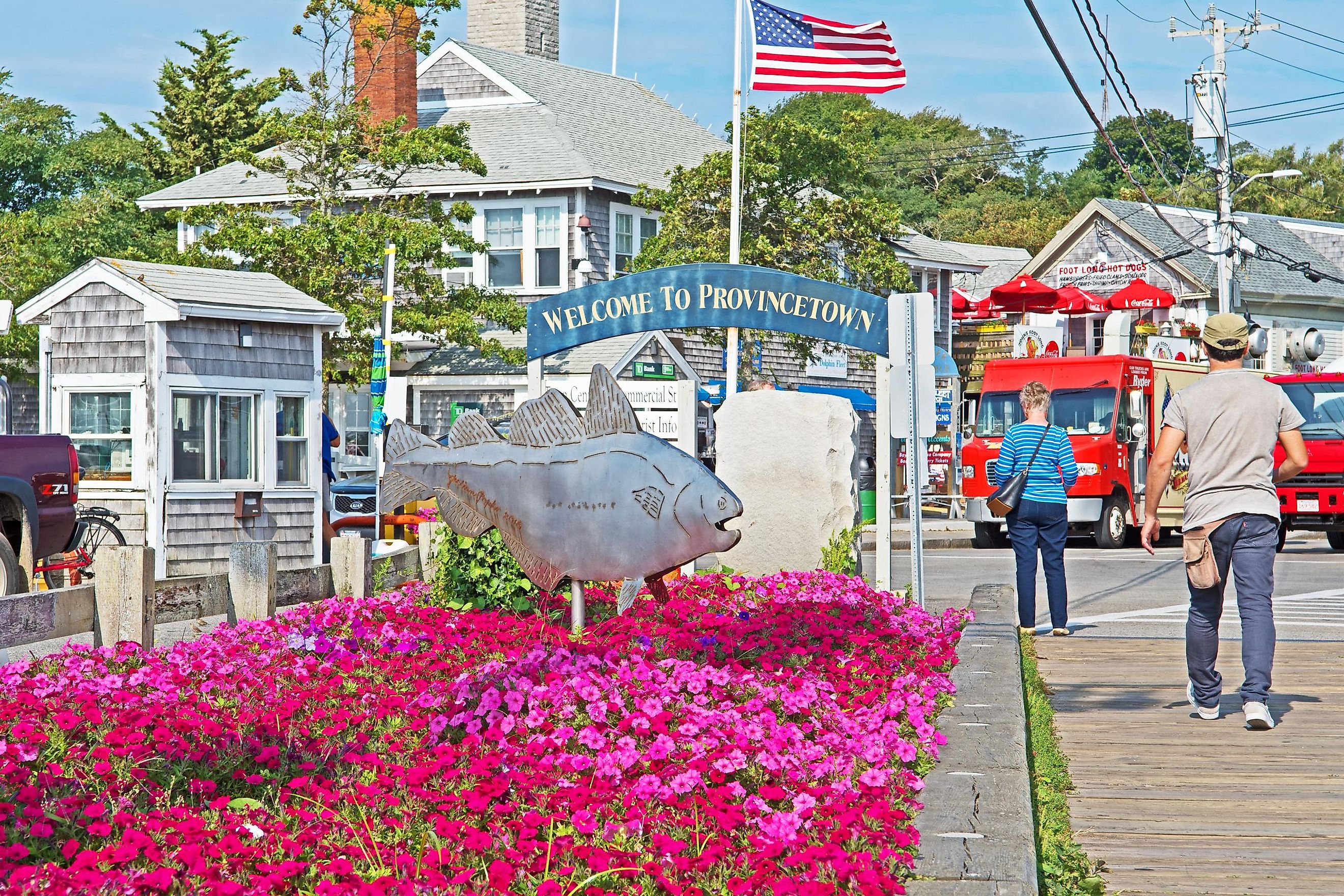at the entry to the Macmillan Wharf, a sign welcomes visitors to Provincetown.