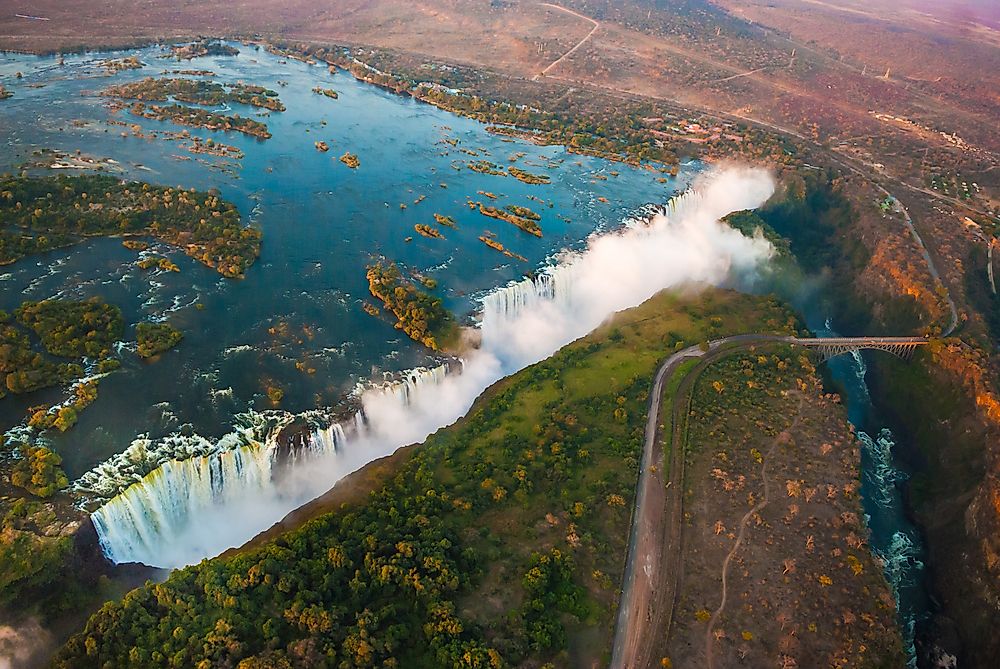 Sun sets upon the Victoria Falls along the Zambia-Zimbabwe border.