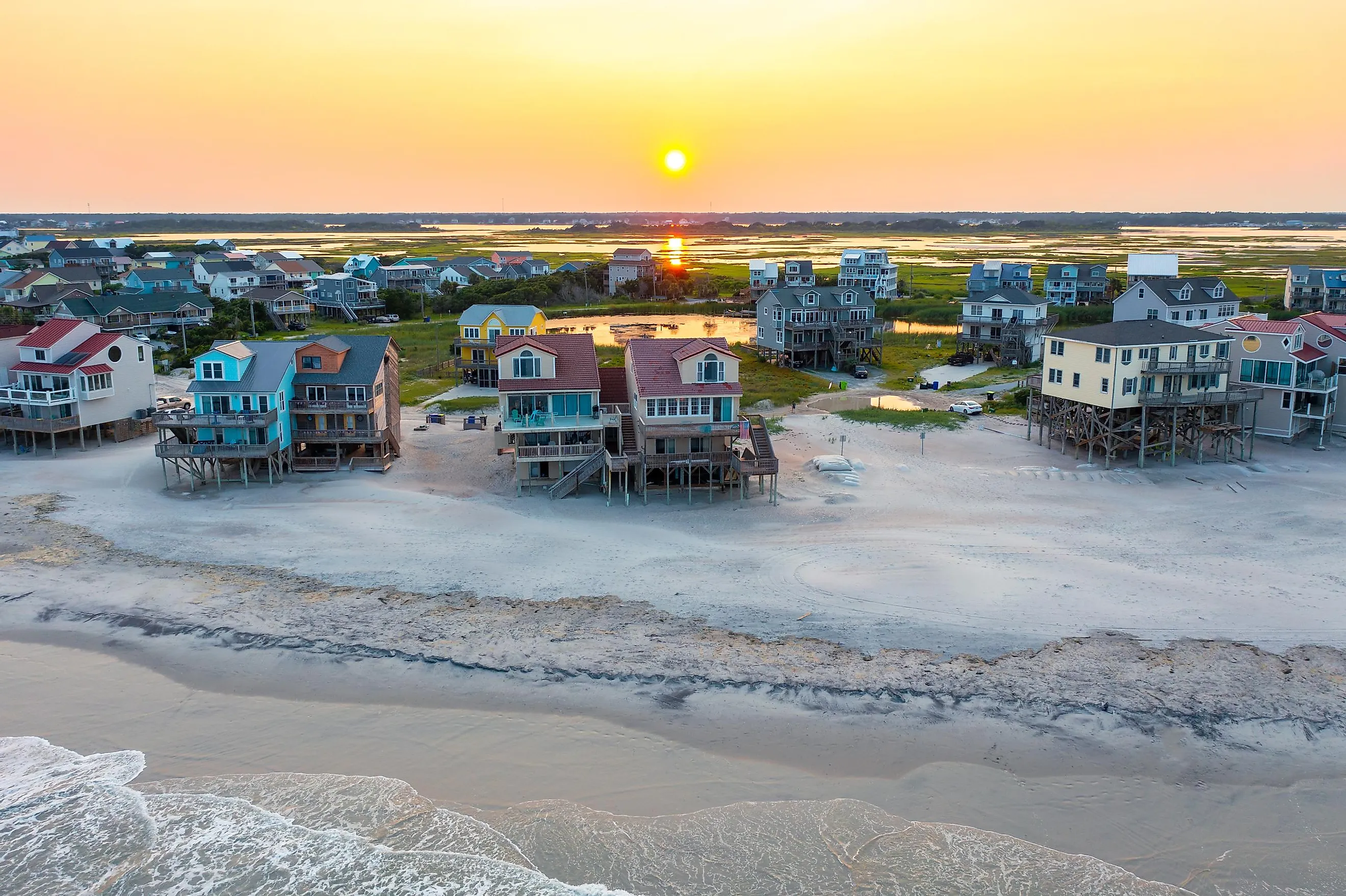 Aerial View of Beach Homes Right on the Shoreline and Marshland in North Topsail Beach at Sunset.