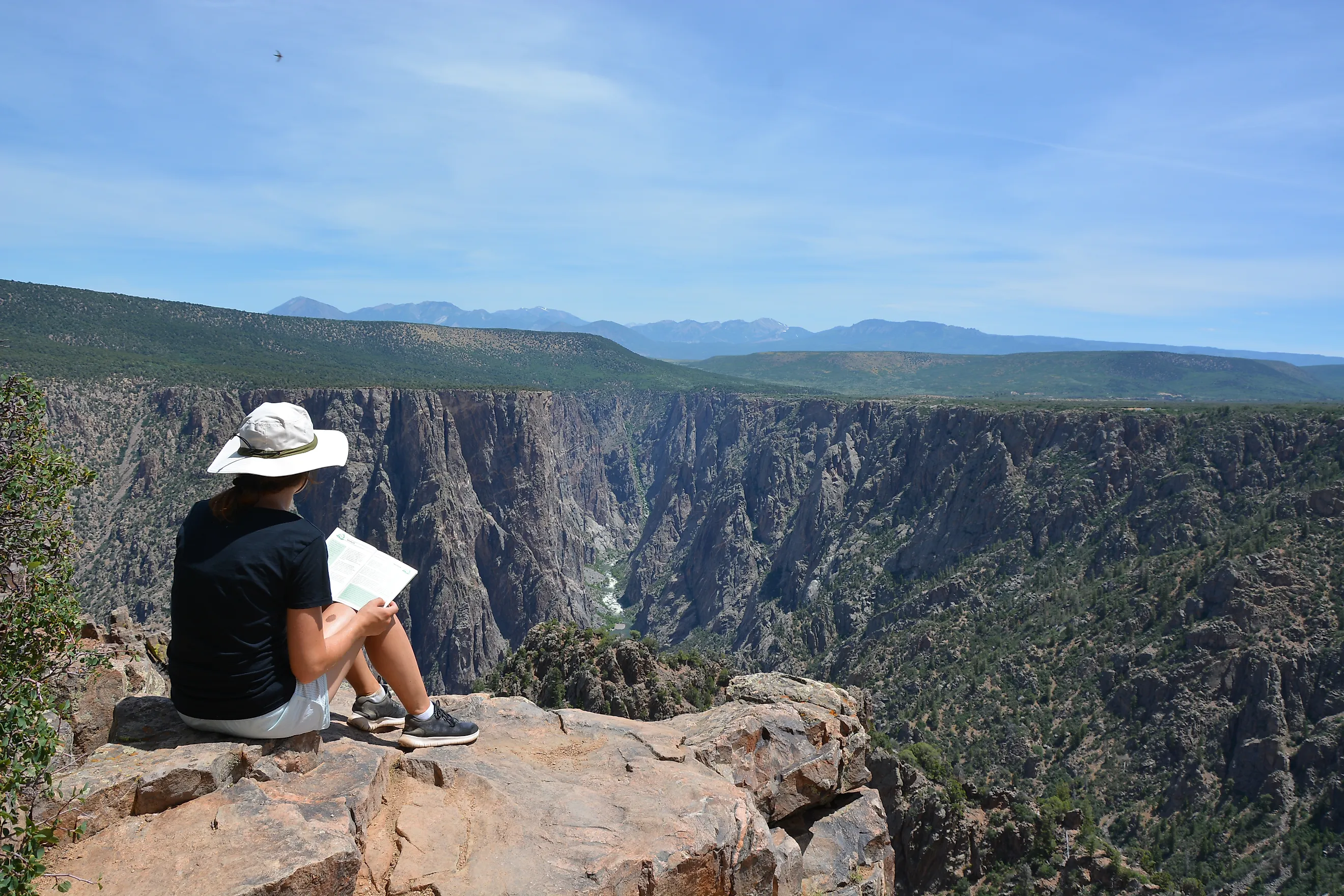A visitor enjoying the spectacular view of the Black Canyon Of The Gunnison National Park.