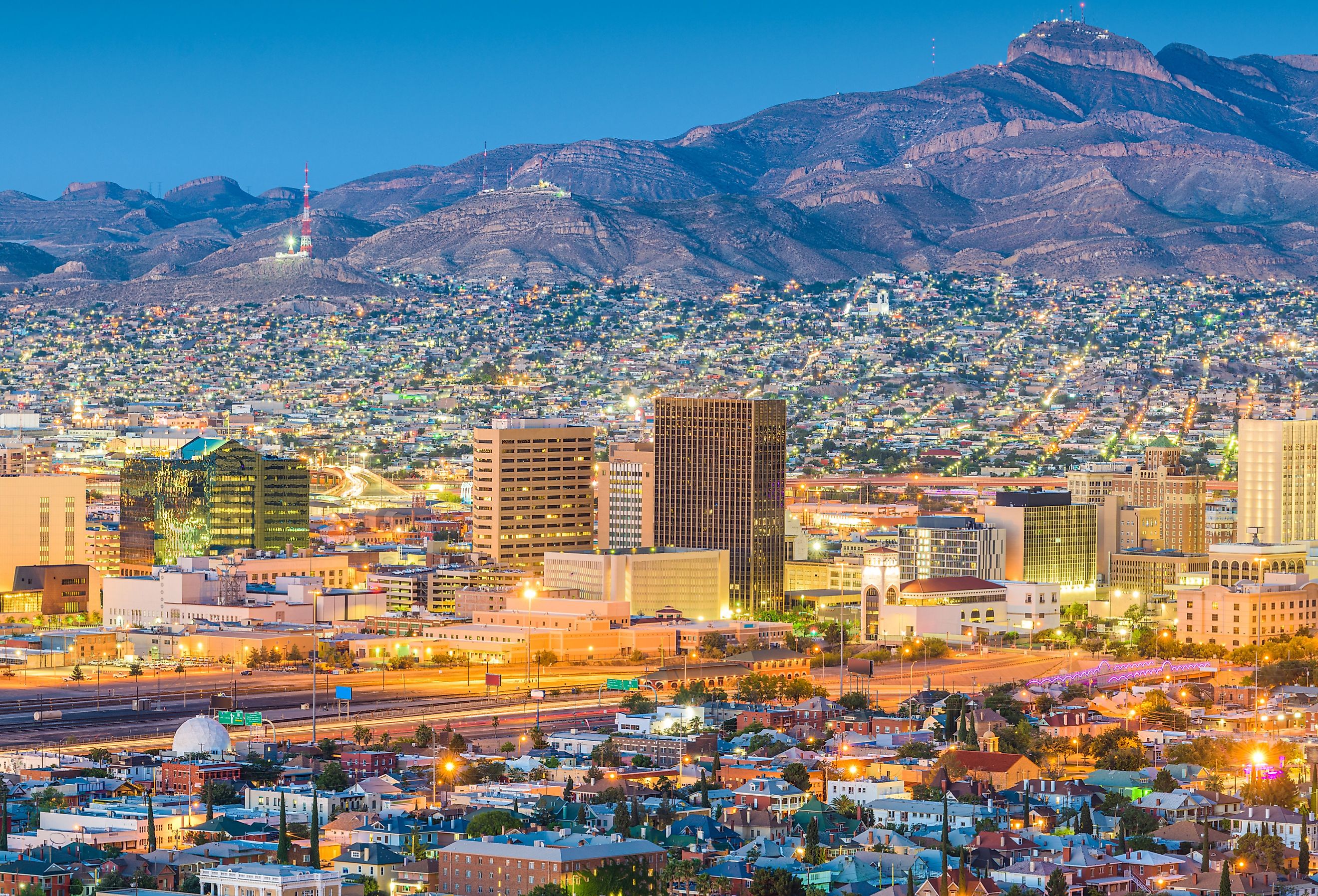 El Paso, Texas, downtown city skyline at dusk with Juarez, Mexico in the distance.