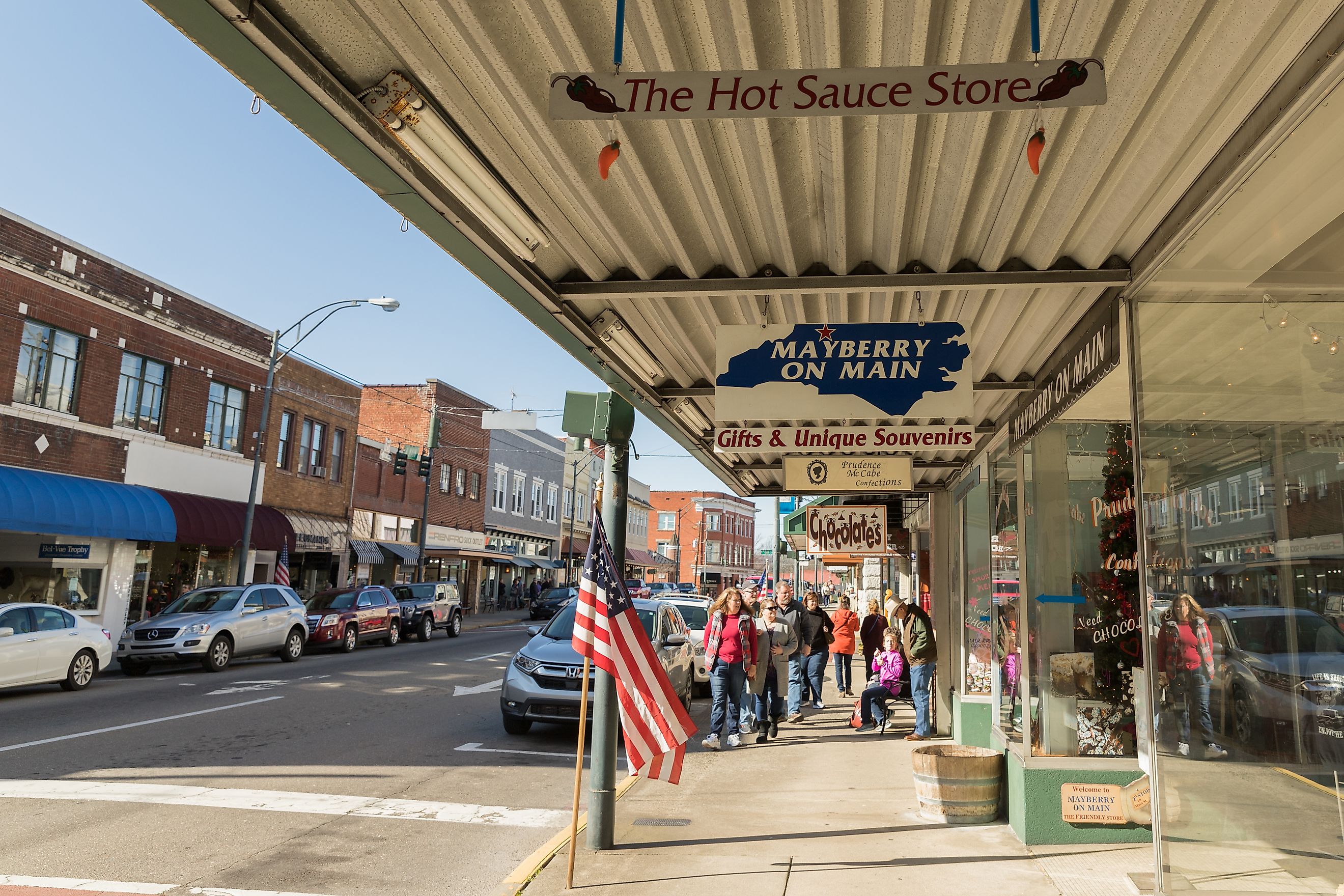 A group of tourist stroll down Main Street in the town that Mayberry from the Andy Griffith show was modeled after in mount airy