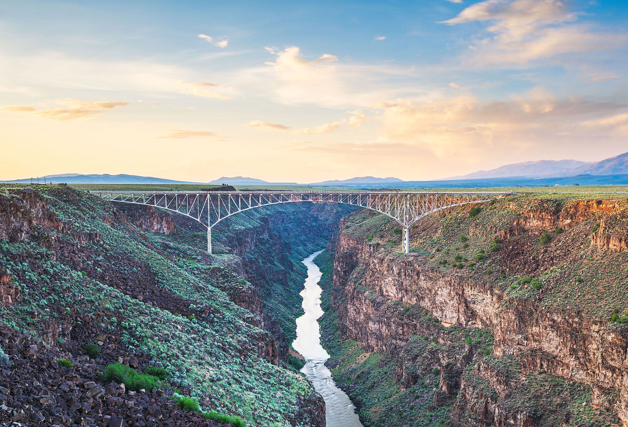 Taos, New Mexico, US at Rio Grande Gorge Bridge over the Rio Grande at dusk. Image credit Sean Pavone via Shutterstock