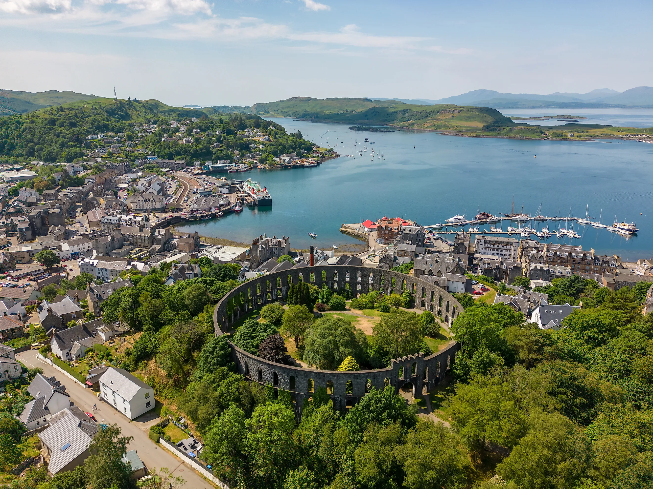 Aerial view of the Mccaig's Tower and Battery Hill in Oban, Scotland.