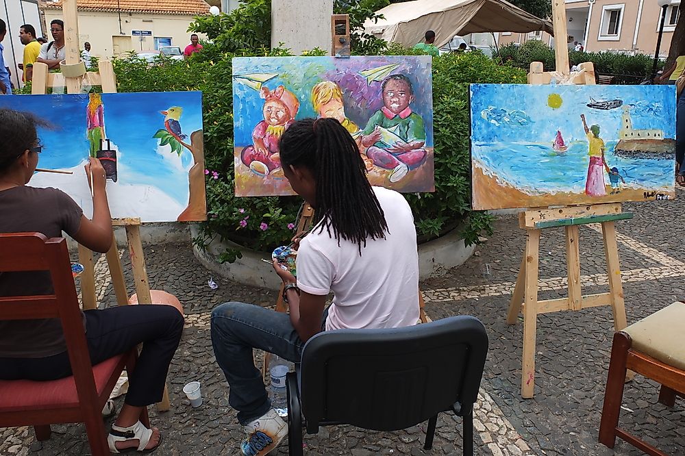 Cape Verdean artists painting in the streets of Praia. Editorial credit: Alain Lauga / Shutterstock.com.