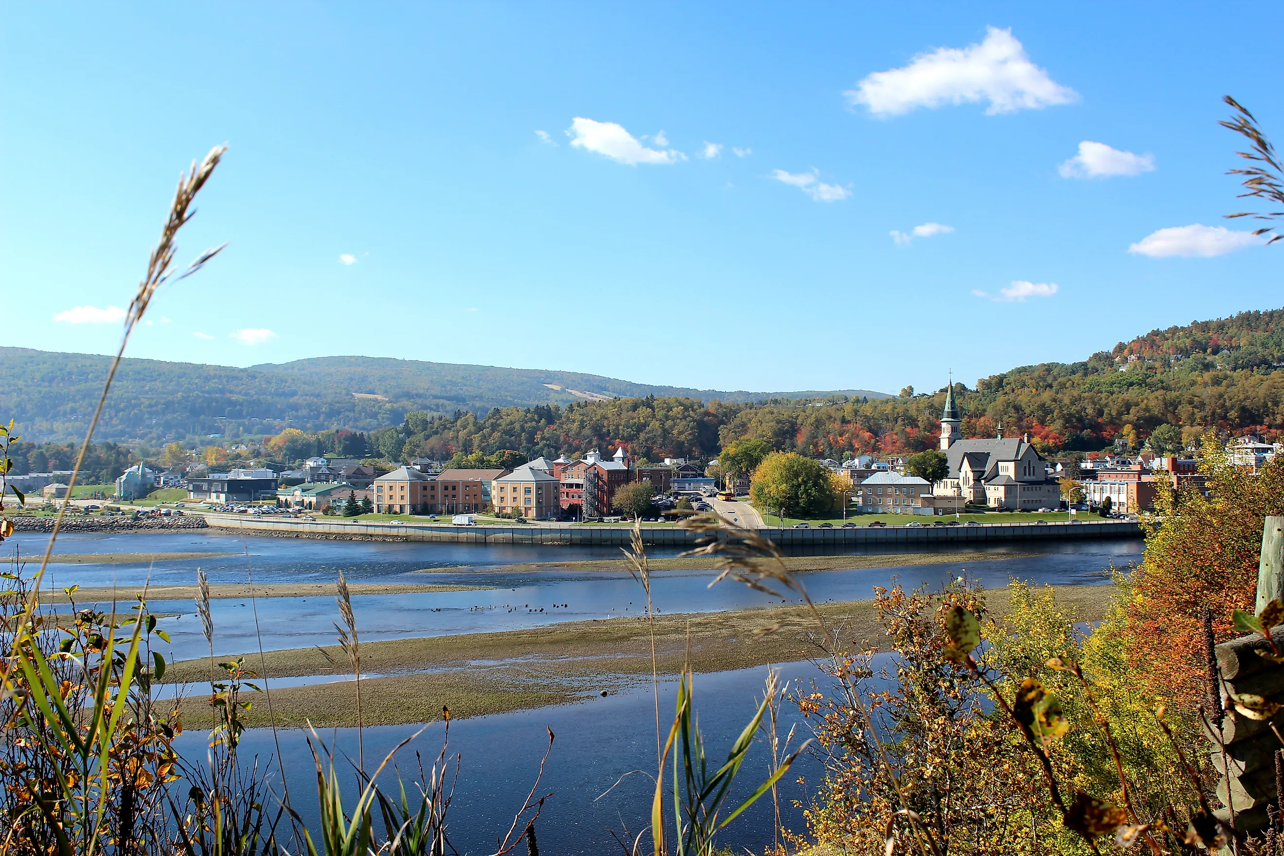 Town of La Malbaie in Quebec, with buildings set against a forested hillside