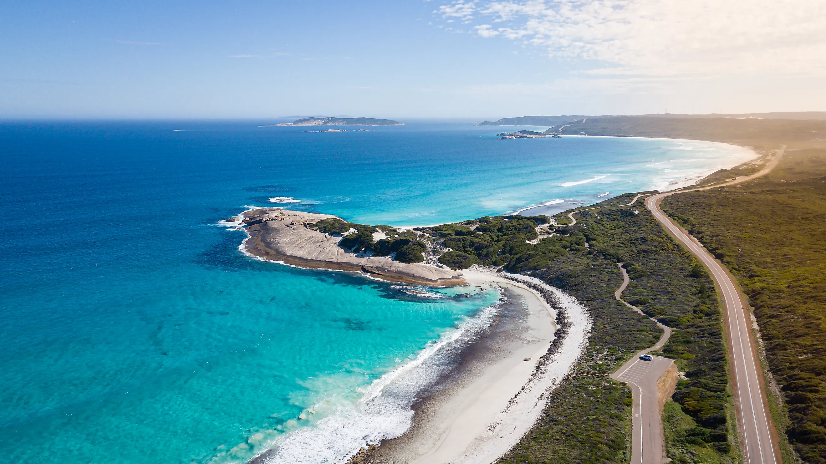 White sand beach and clear blue water in Esperance, Western Australia, under a bright blue sky.