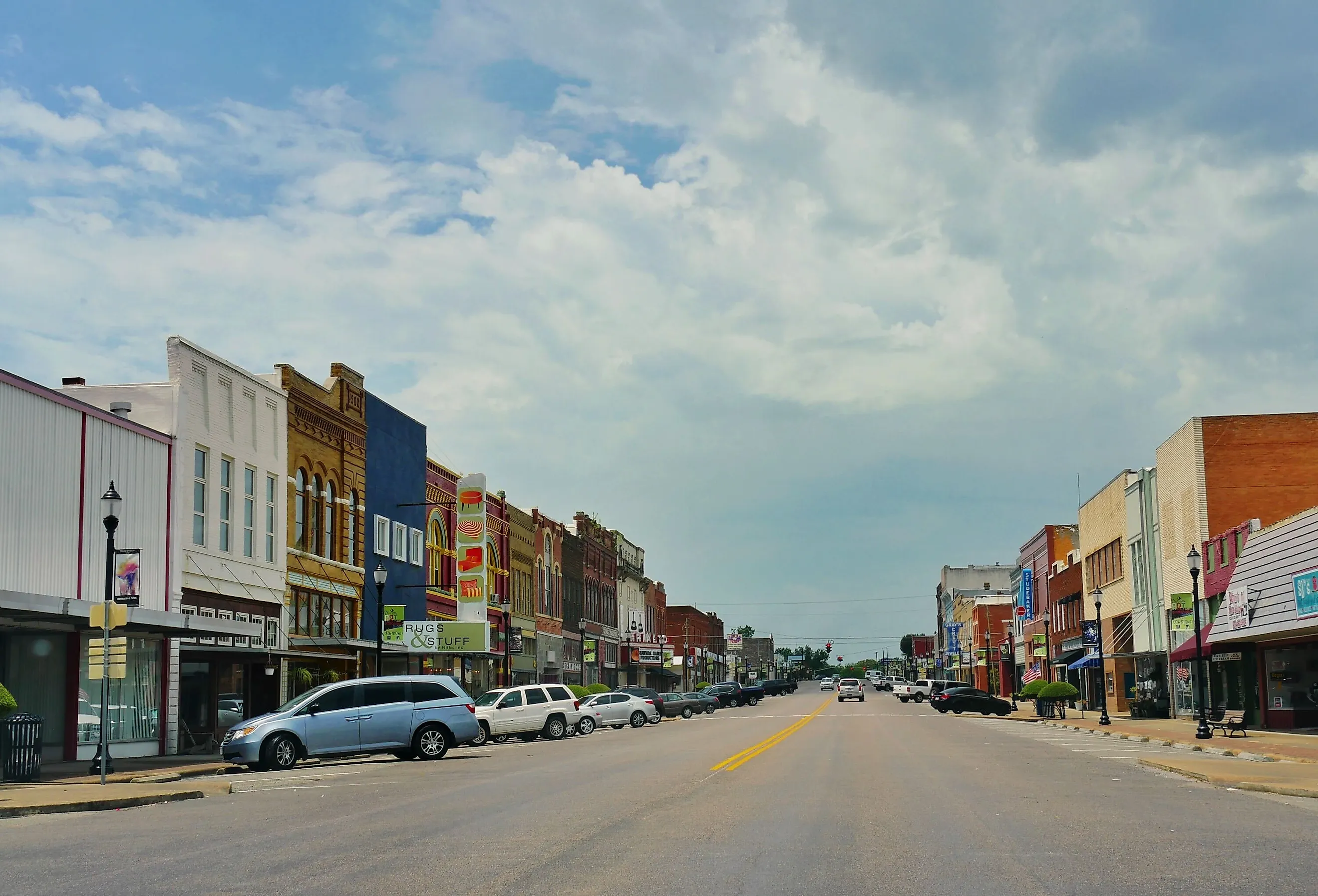 Old buildlings and cars parked on the curb side at the main street of Denison, Texas, Editorial credit: RaksyBH / Shutterstock.com