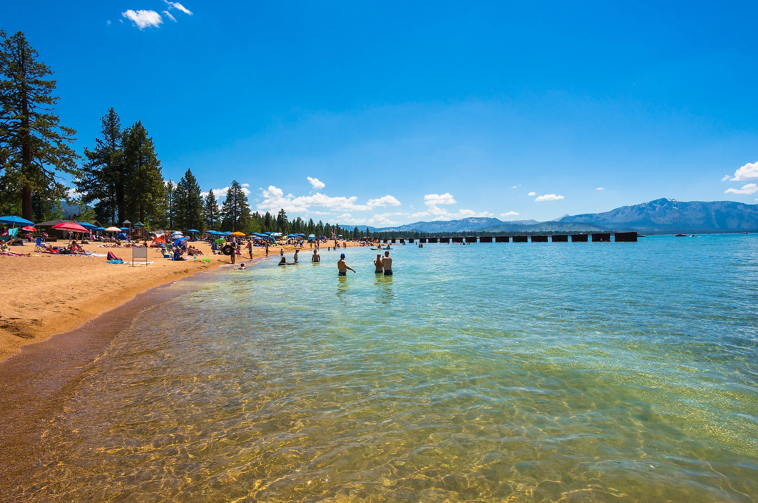 People enjoying the day at the beach in Lake Tahoe, CA, USA