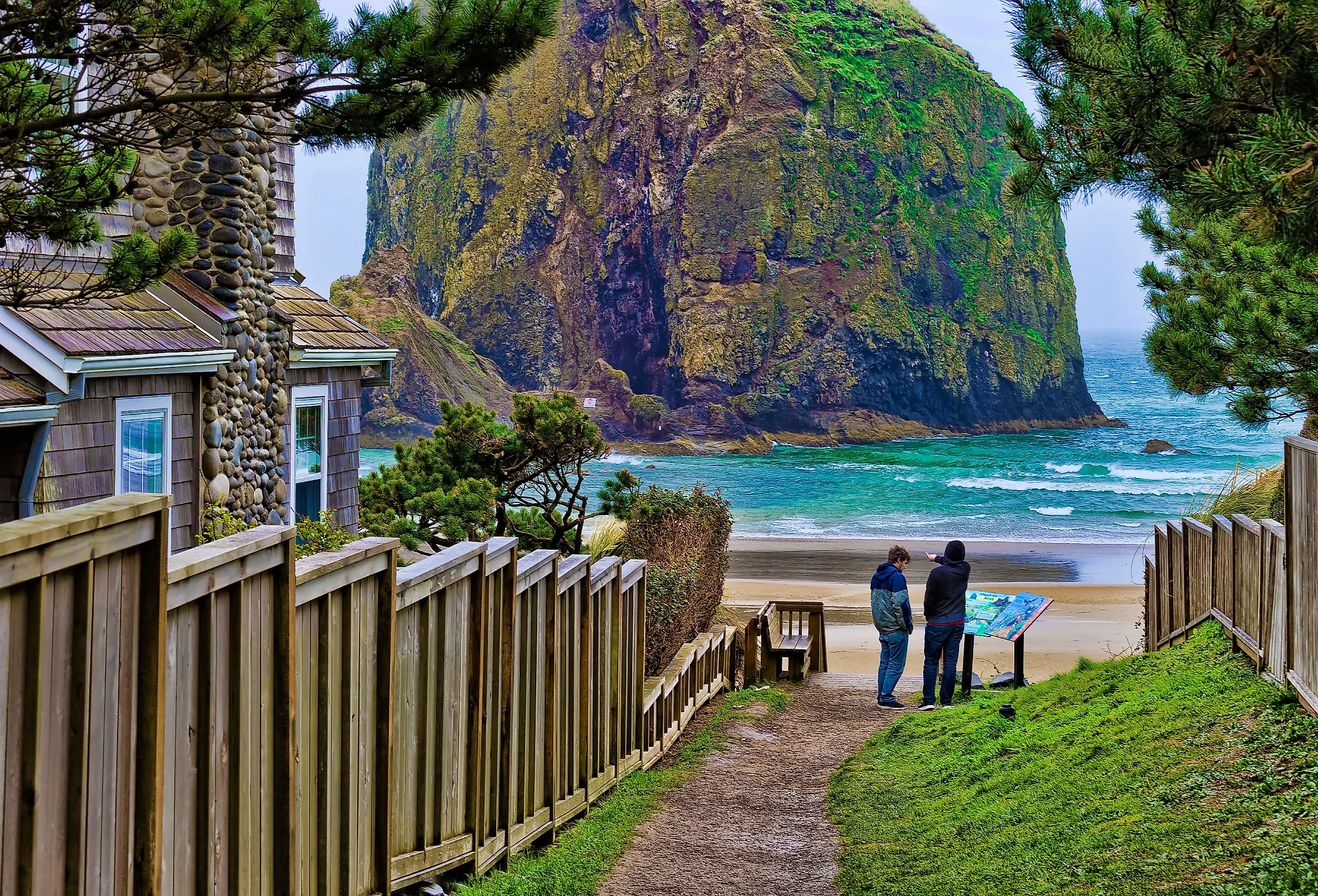 Public beach access path at Cannon Beach, Oregon, with the stunning coastline and Haystack Rock.