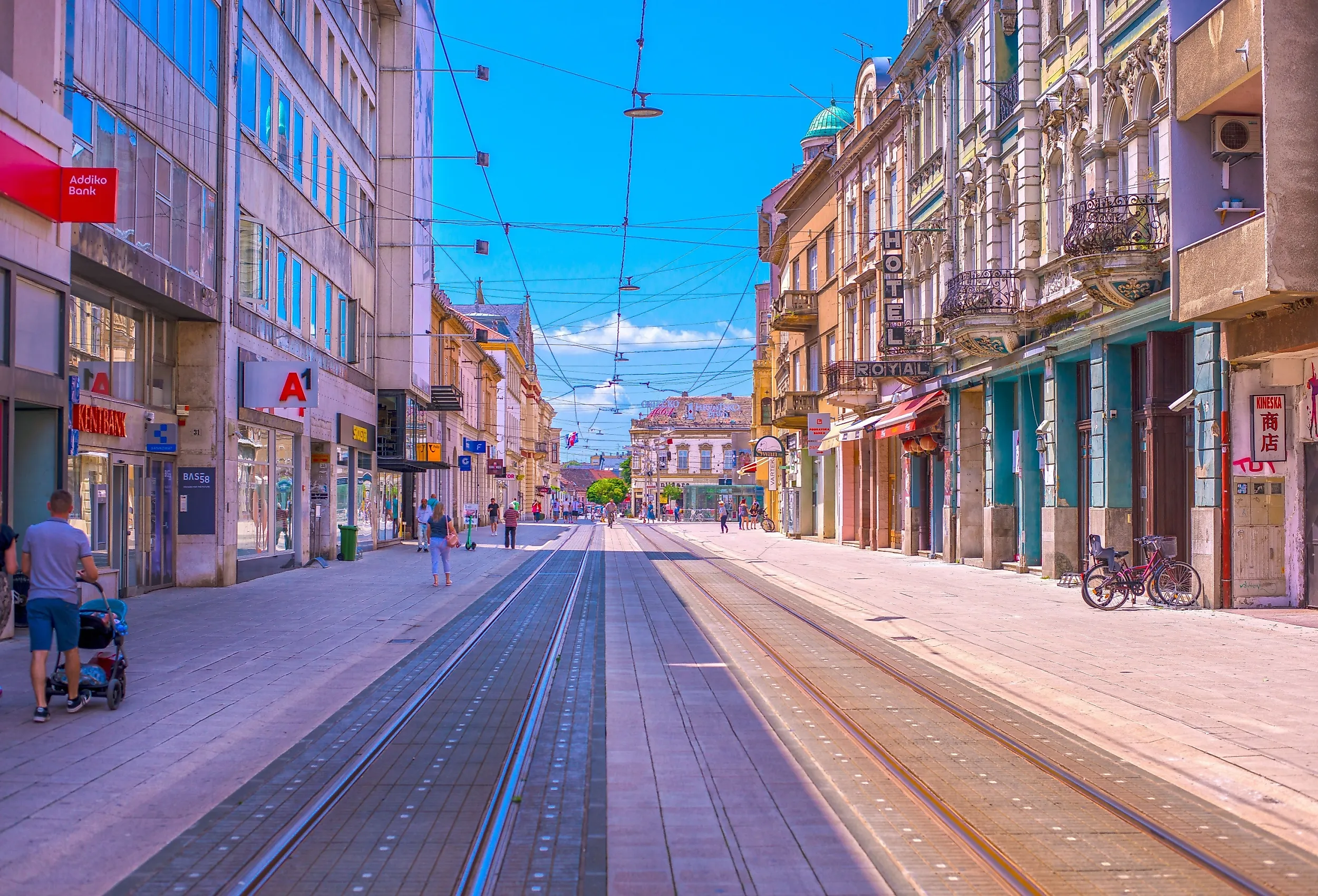 A scenic view of Main Street in Osijek, showcasing the city's vibrant urban landscape, historical buildings, and modern city life along the street. Image credit: ZdravkoT via Shutterstock.