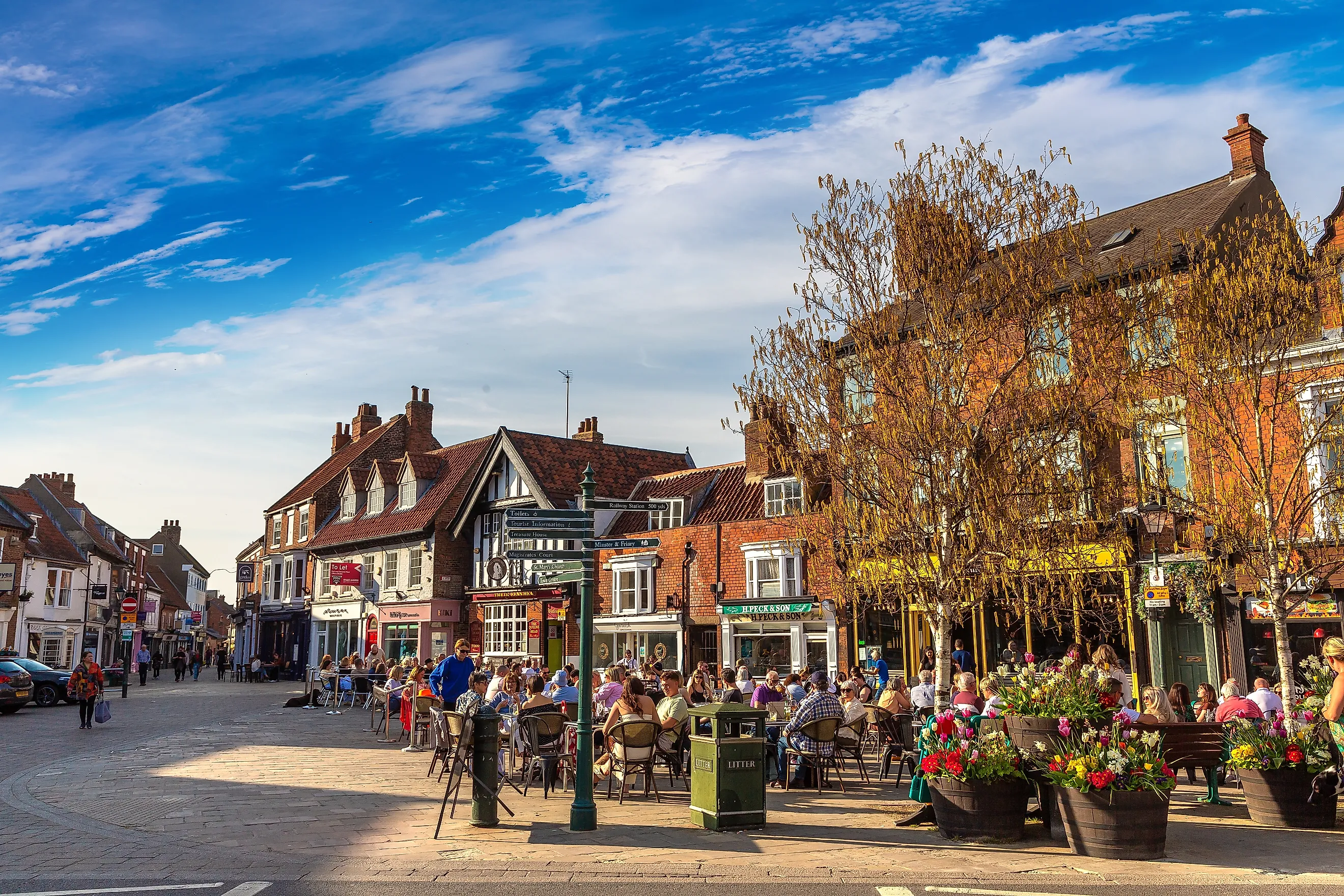 Street cafe with people eating at outdoor tables in Historic Town Centre of Beverley, East Riding of Yorkshire, England. 