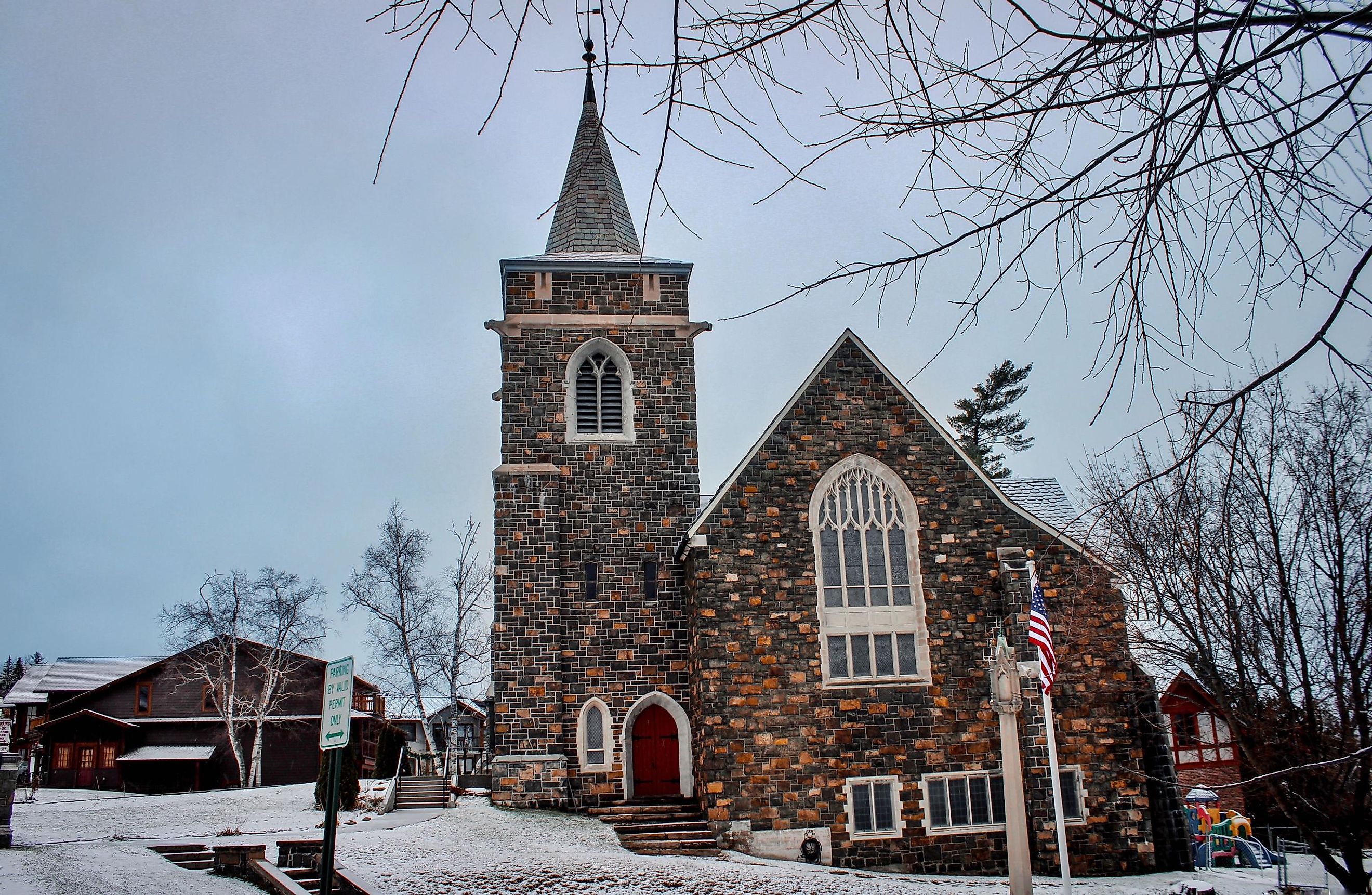Adirondack Community Church, an ancient church on a snowy day in Winter in Lake Placid, New York