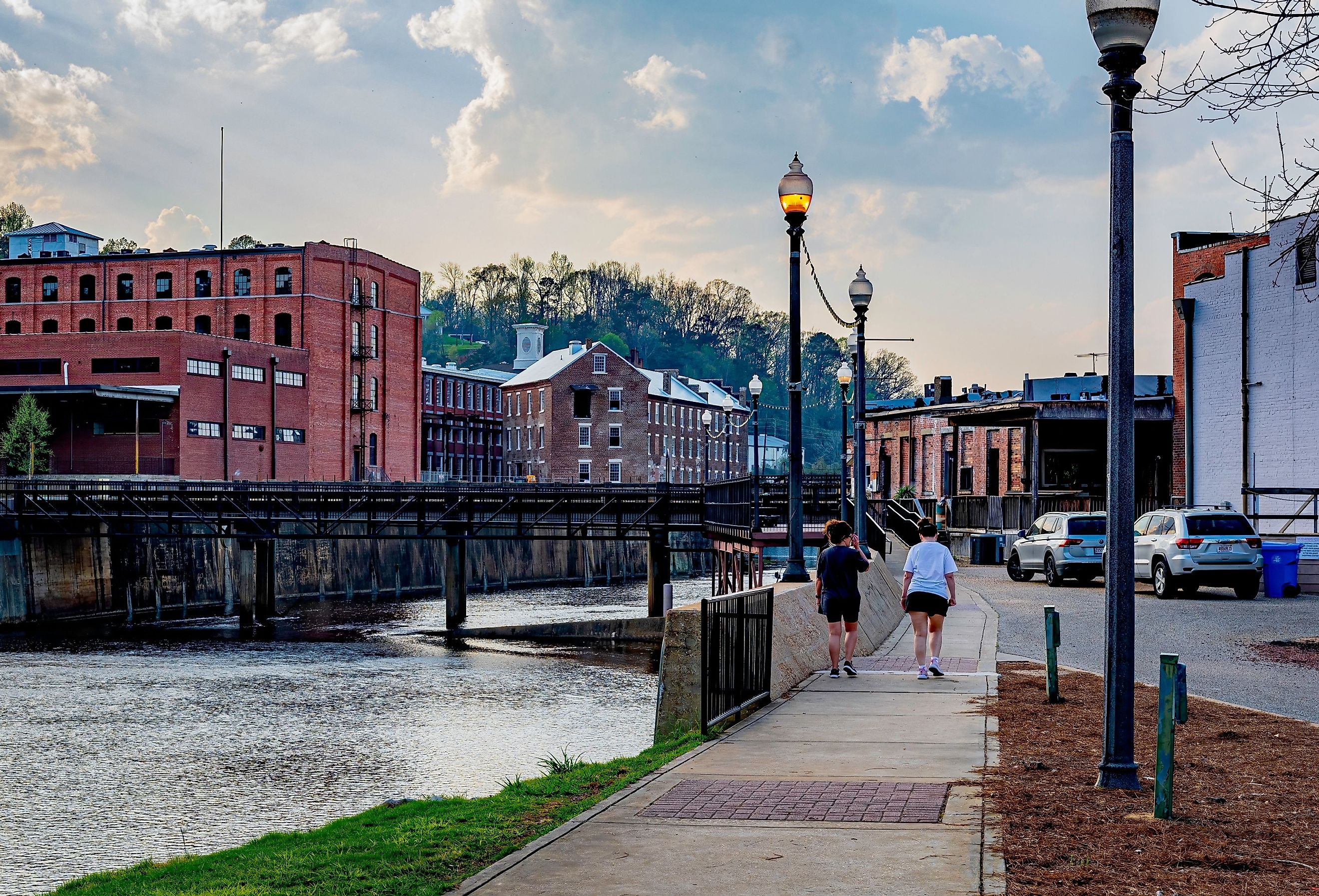 Two women walk along the picturesque Creek walk in historic downtown Prattville, Alabama. Image credit JNix via Shutterstock