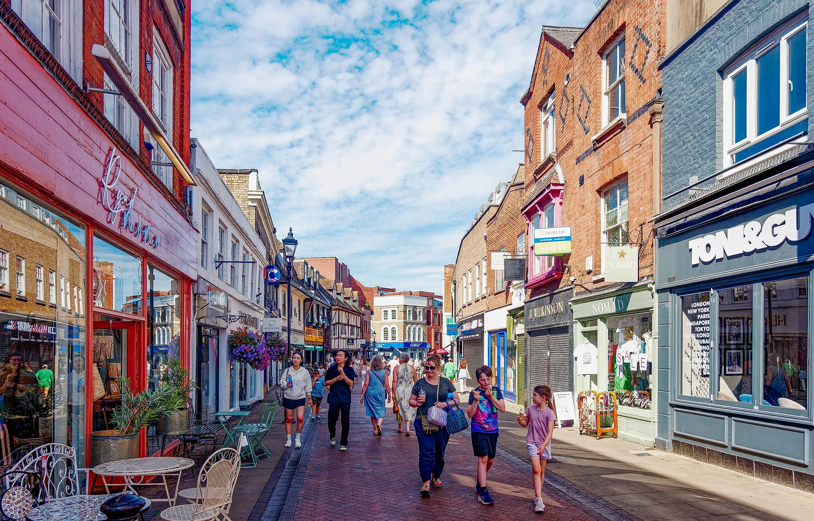 Tourists stroll through the pedestrian shopping streets of Windsor, England. Image credit: Darryl Brooks / Shutterstock.com.