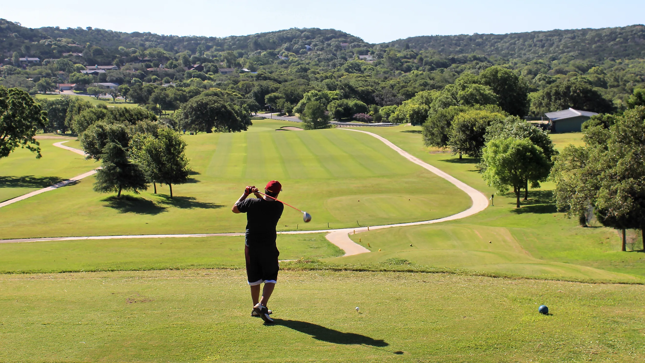 A golfer takes a practice swing at the Scott Schreiner Municipal Golf Course in Kerrville, Texas, United States.