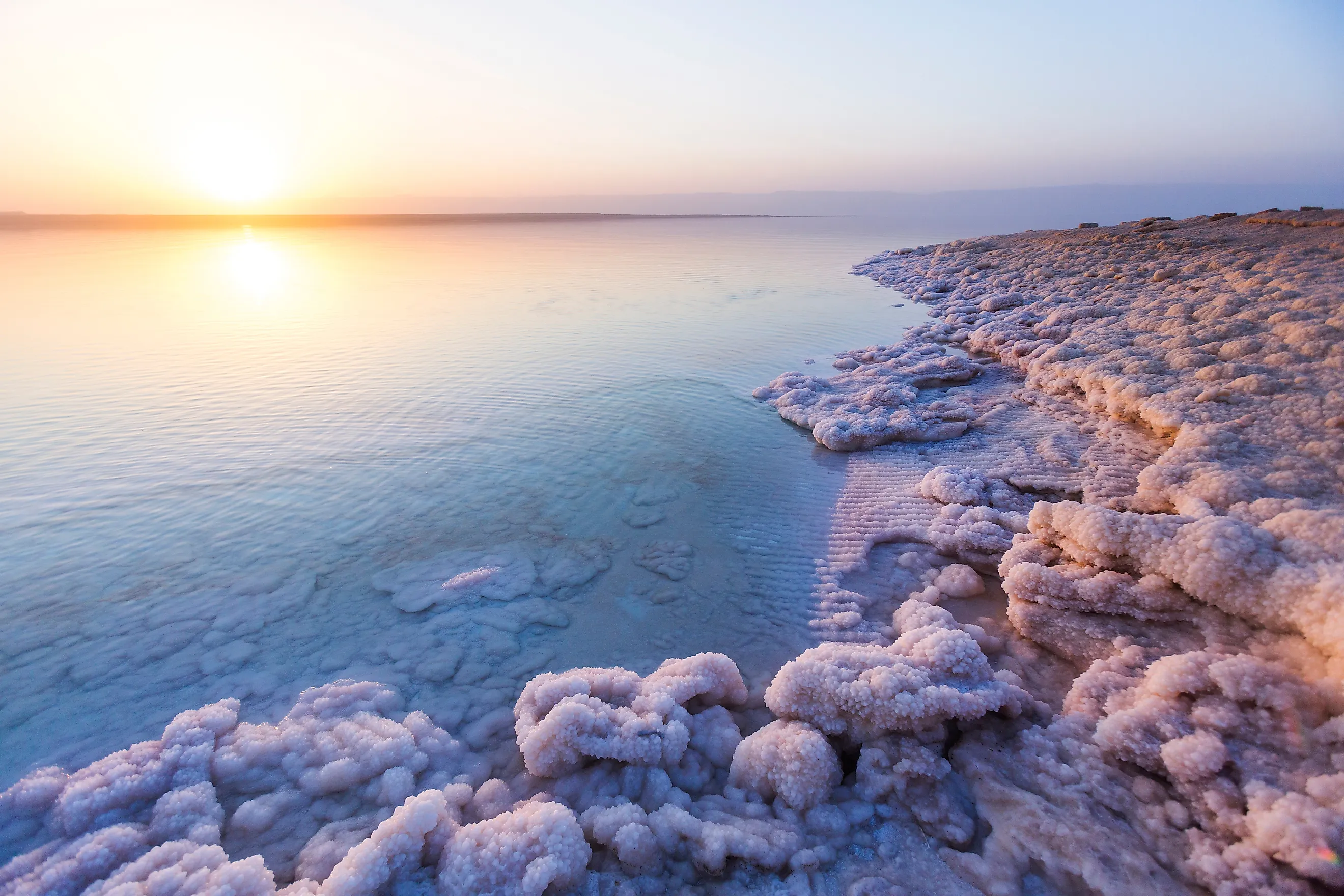 Salt on the shore of the Dead Sea. Jordan sunset landscape